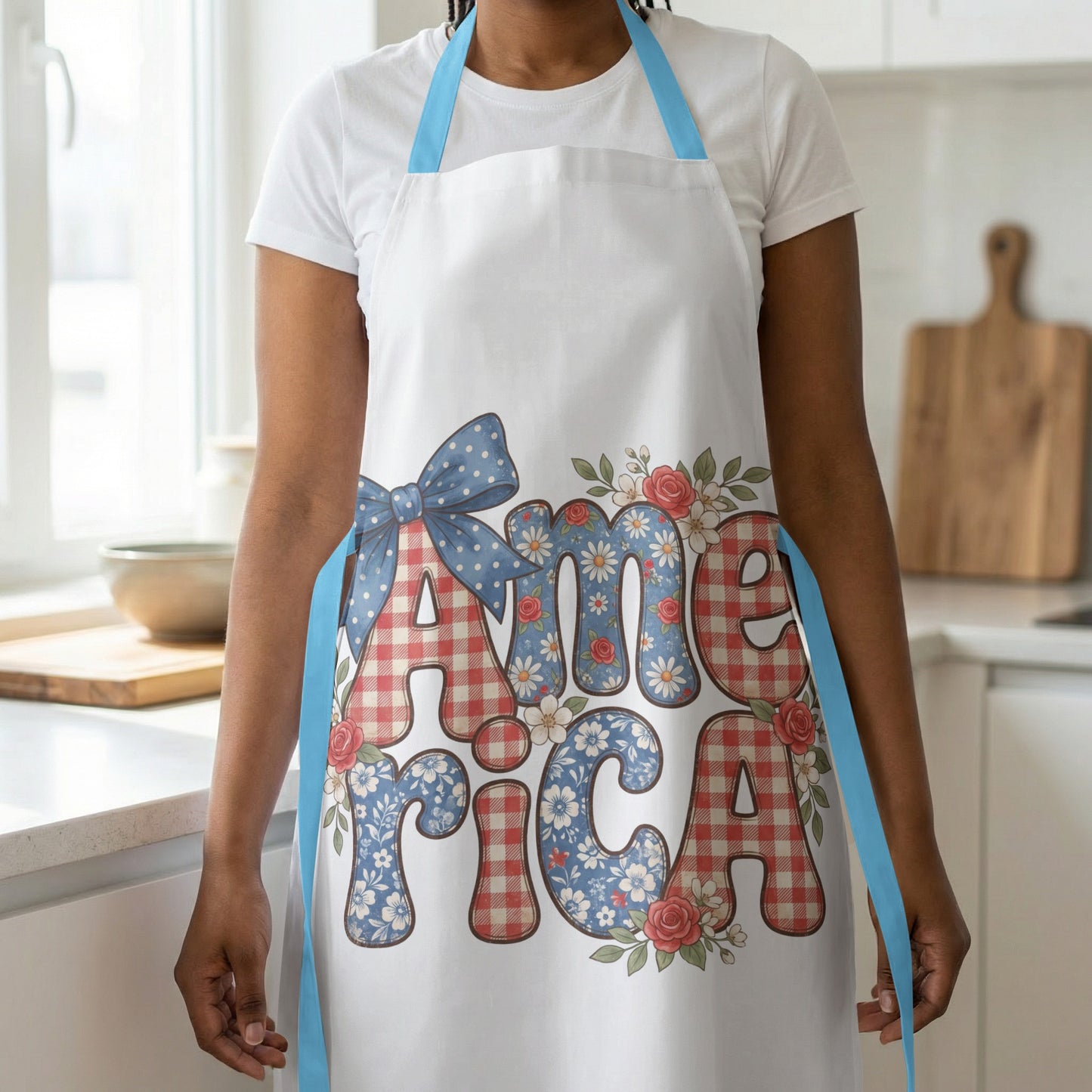 White apron with blue straps, featuring the word "America" in patterned letters.