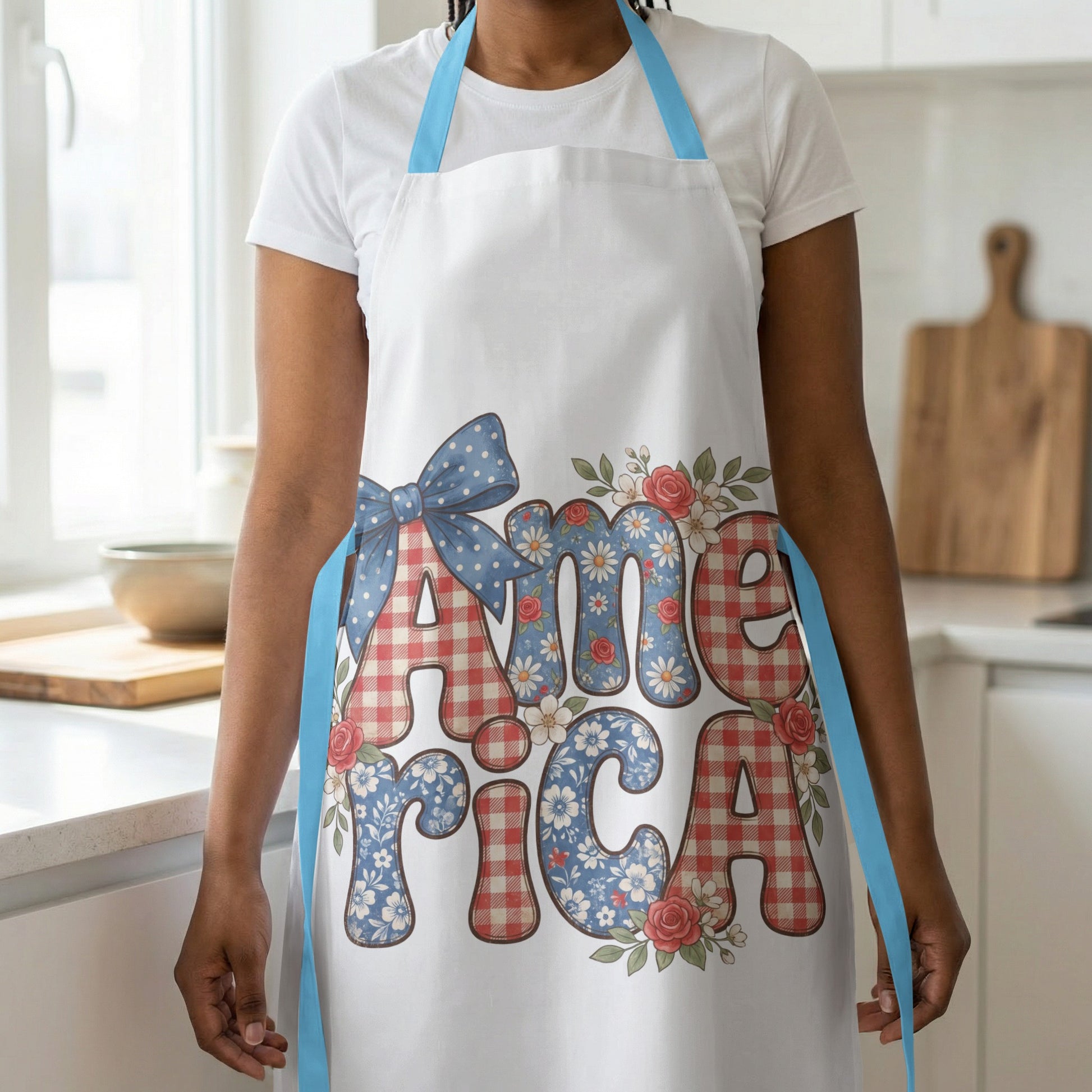White apron with blue straps, featuring the word "America" in patterned letters.
