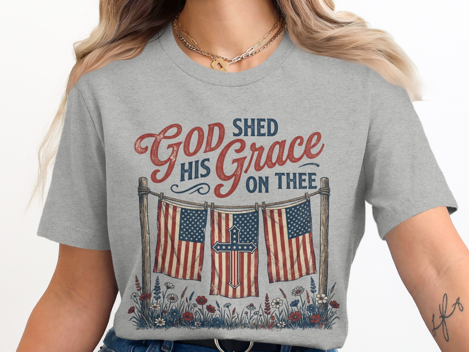 Gray t-shirt with American flags, a cross, and "God Shed His Grace On Thee" text.