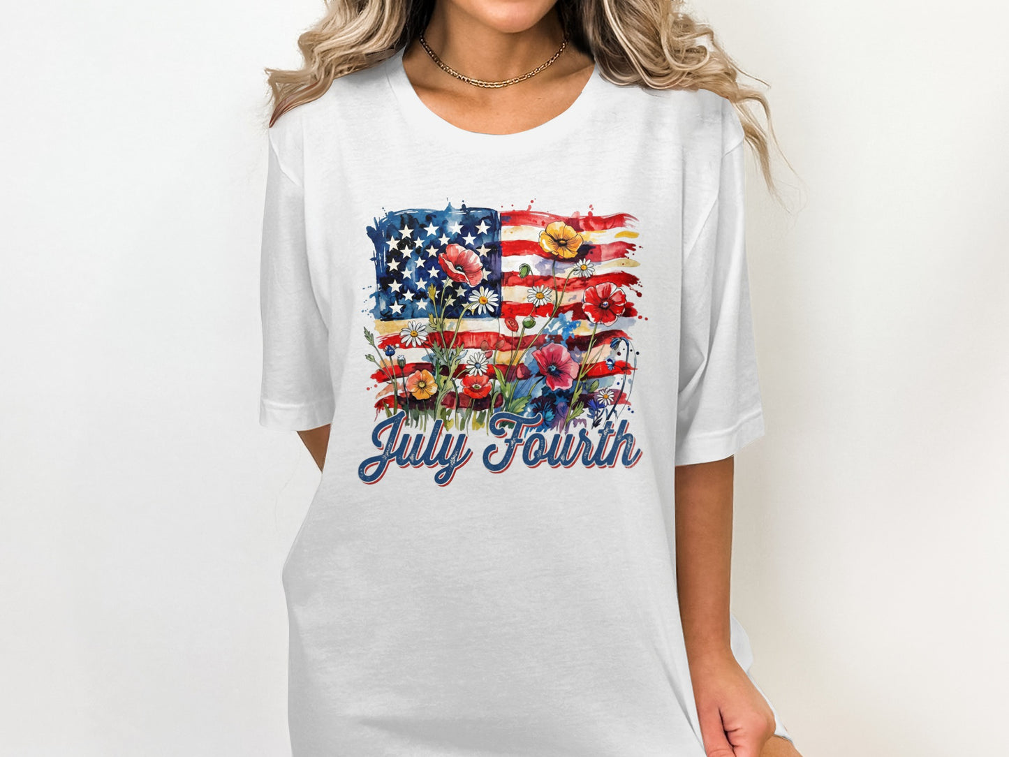 White t-shirt with American flag and floral design, text "July Fourth".