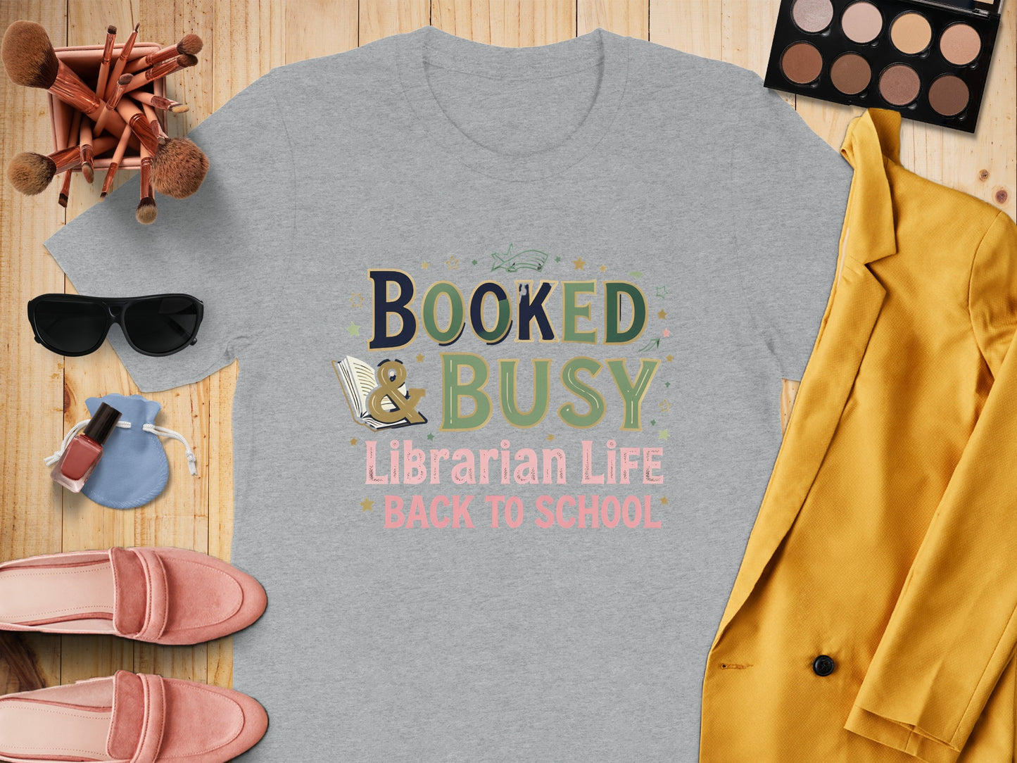 Gray t-shirt with "Booked & Busy Librarian Life Back to School" text.