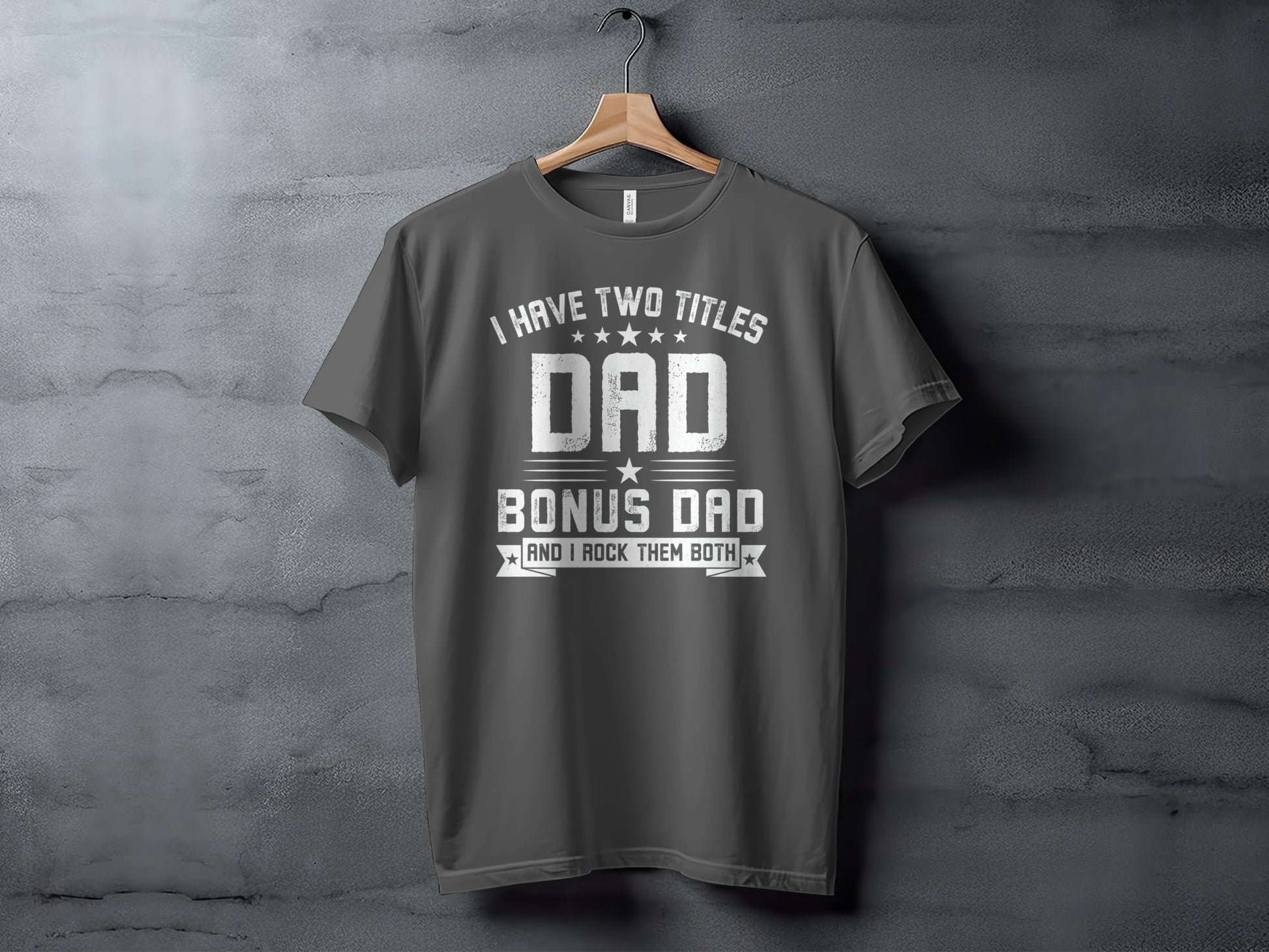 Dark grey t-shirt with white text: "I HAVE TWO TITLES DAD BONUS DAD AND I ROCK THEM BOTH".