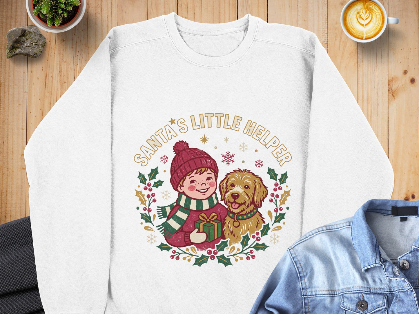 White sweatshirt with "Santa's Little Helper" text and illustration of a child and dog.