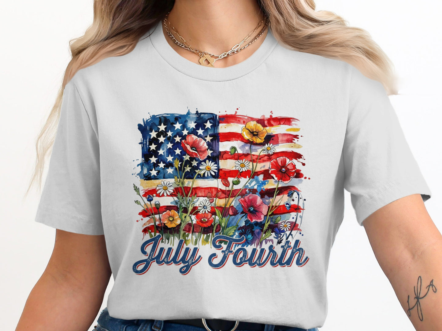 White t-shirt with watercolor American flag and red, white, and blue flowers, says "July Fourth".