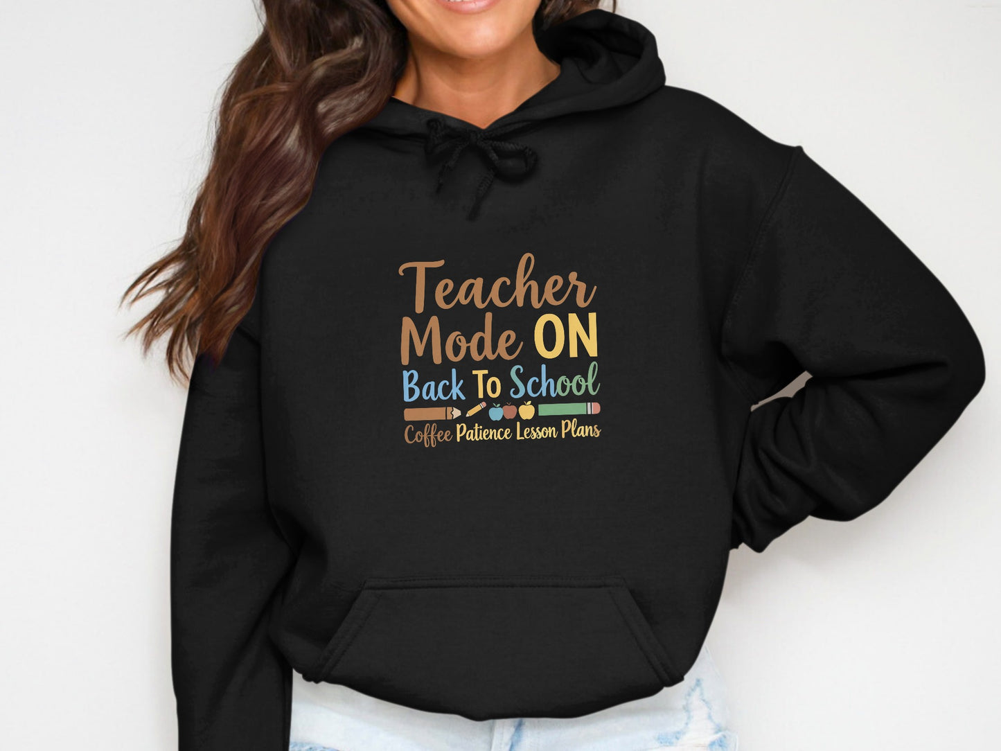 Black hoodie with "Teacher Mode ON Back To School" and "Coffee Patience Lesson Plans" text.