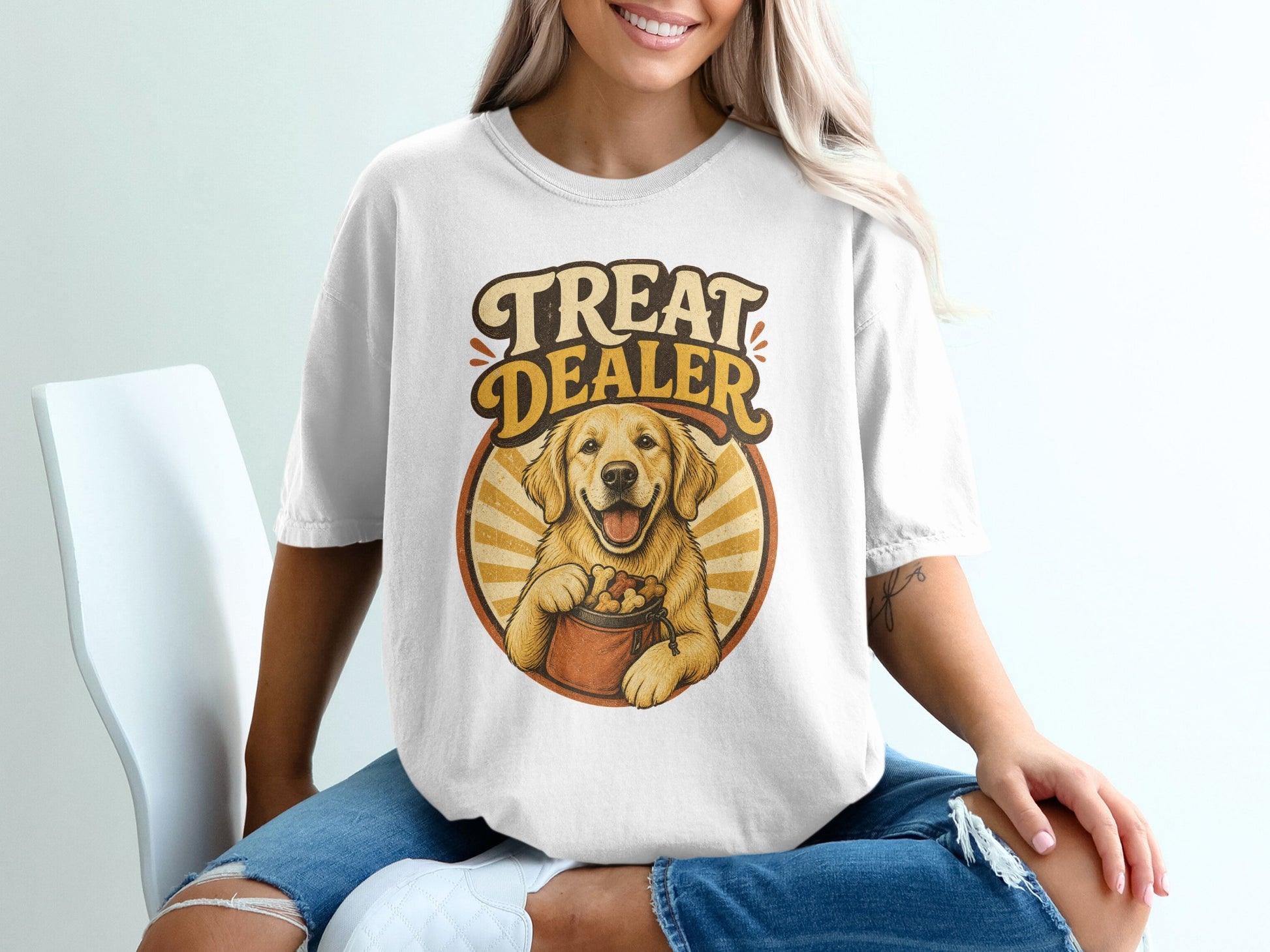 White t-shirt with "Treat Dealer" text and golden retriever holding a bag of treats.