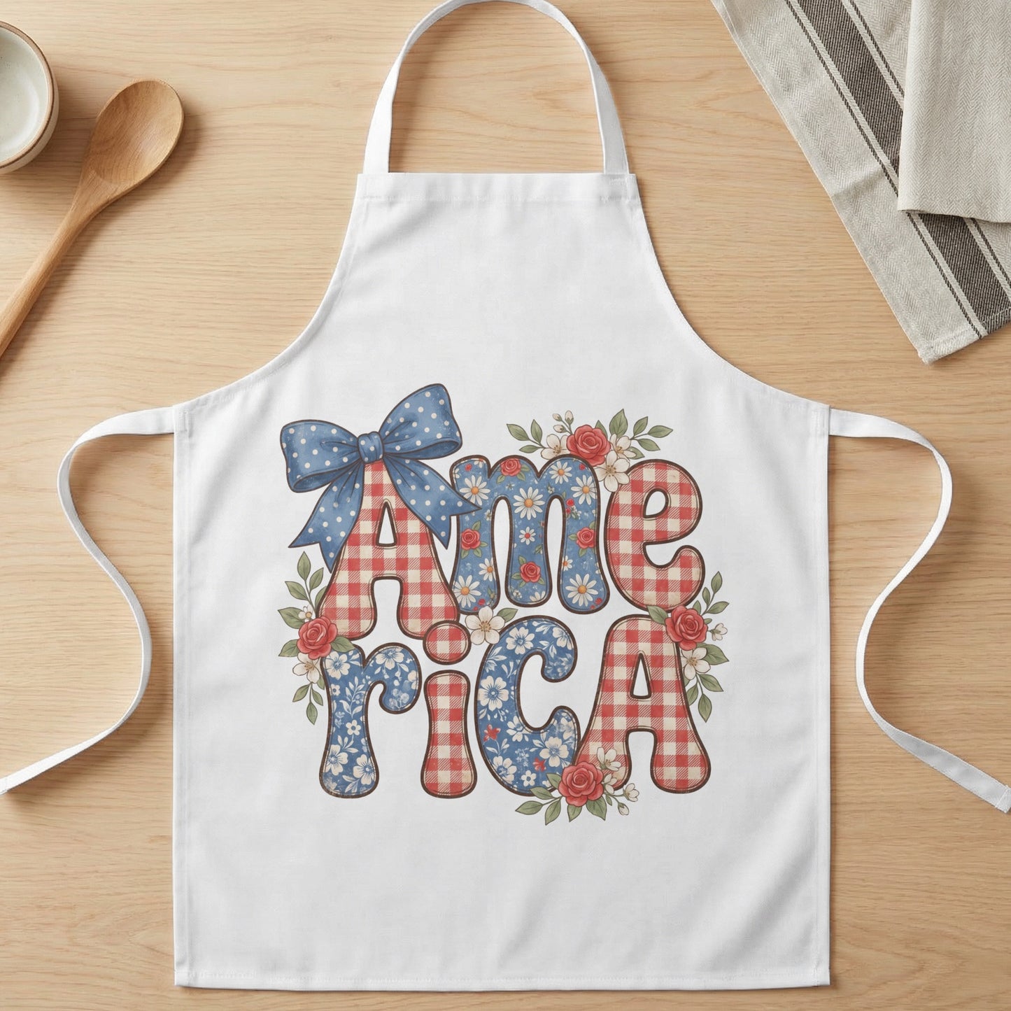 White apron with "America" text in red gingham and floral patterns.