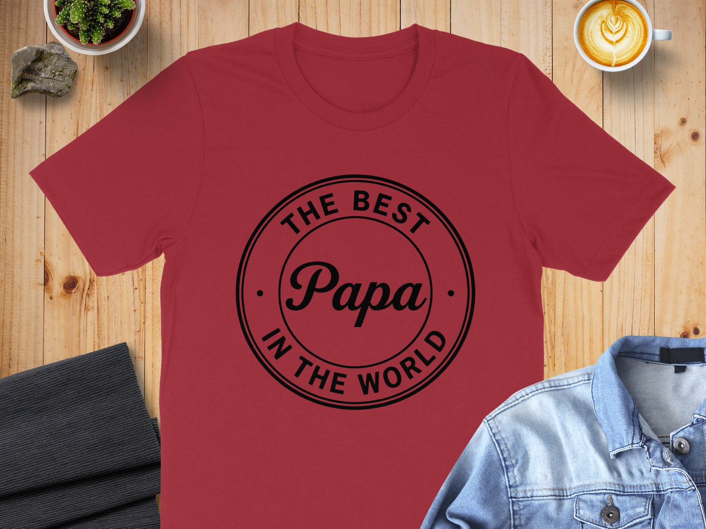 Red t-shirt with "The Best Papa In The World" text in a black circle.