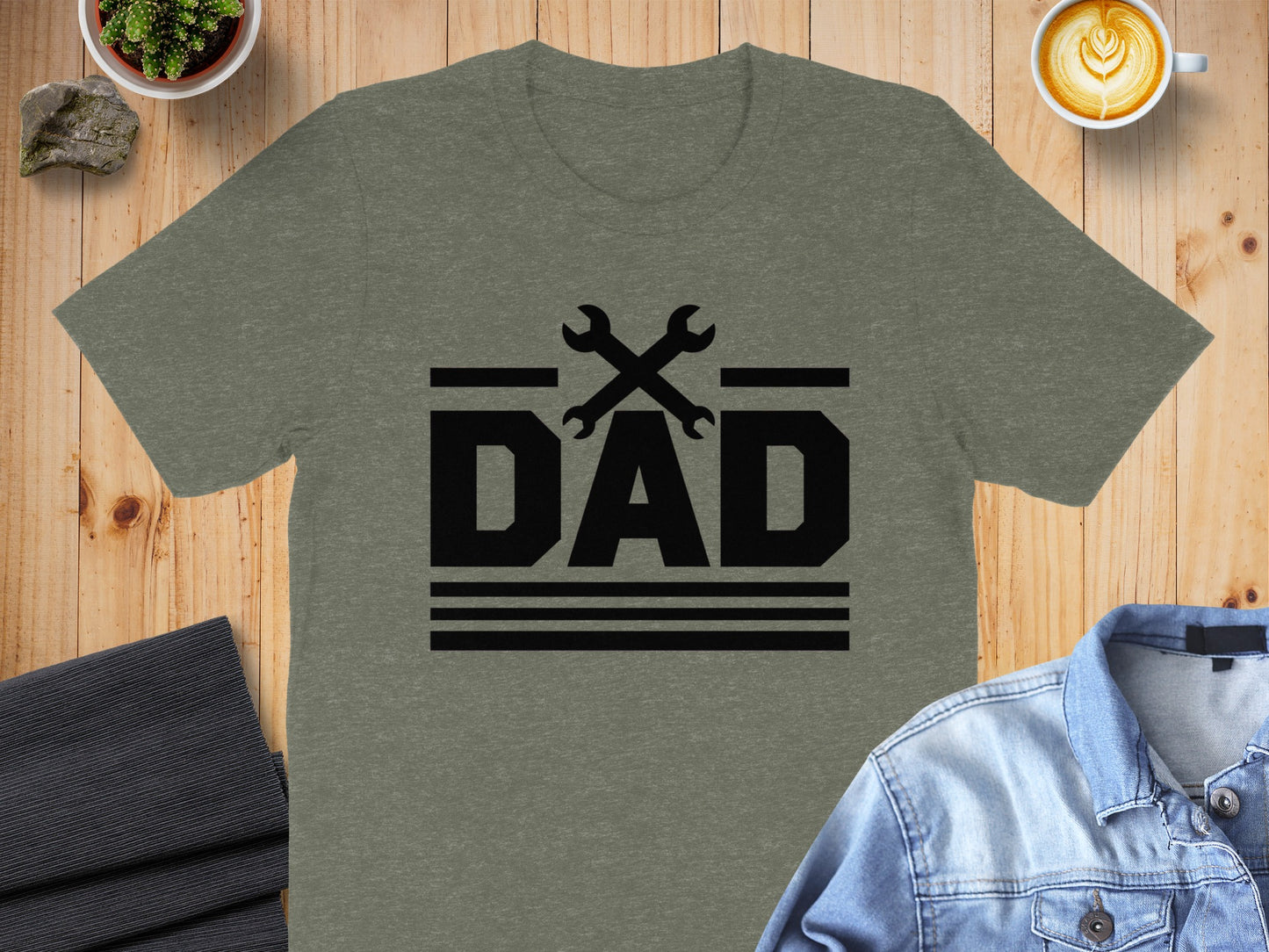 Heather grey t-shirt with black "DAD" text and crossed wrenches graphic.