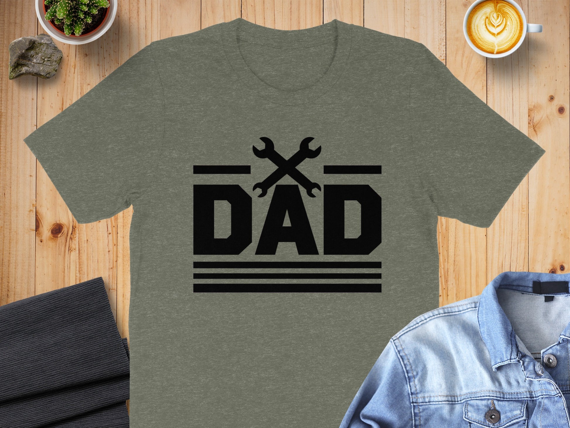 Heather grey t-shirt with black "DAD" text and crossed wrenches graphic.