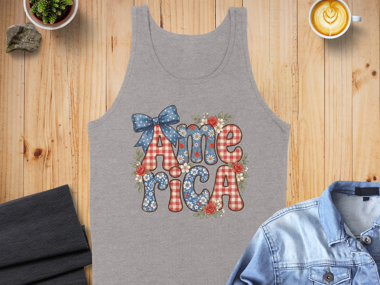 Gray tank top with "America" graphic featuring blue and red plaid and floral patterns.