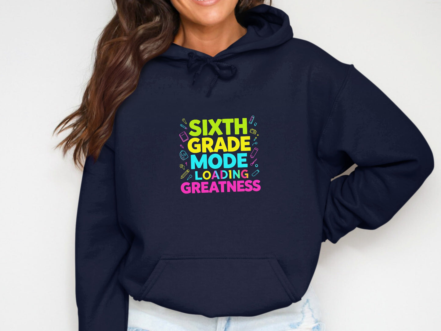 Navy hoodie with "Sixth Grade Mode Loading Greatness" text and school supplies.
