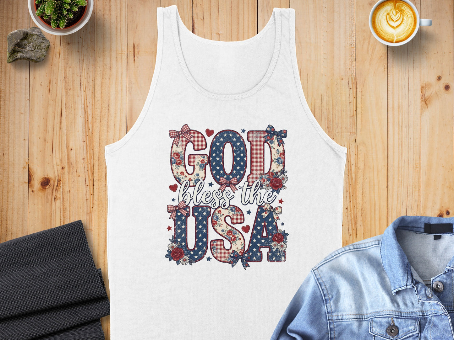 White tank top with "God bless the USA" text and patriotic floral patterns.