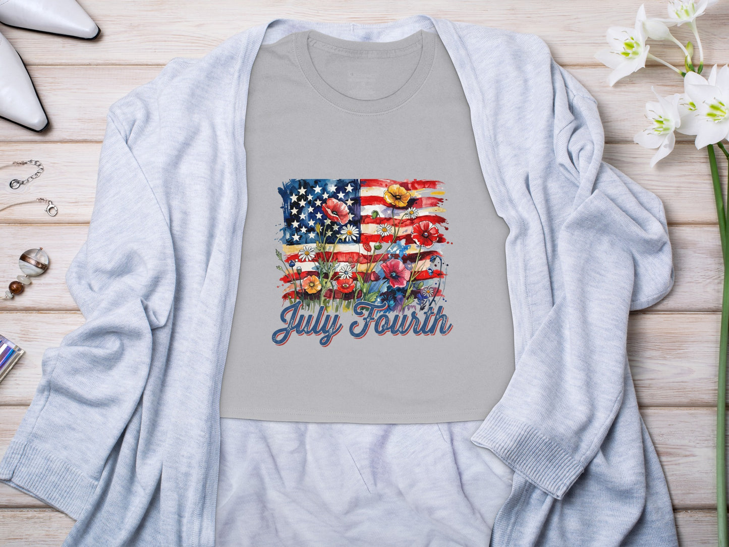 Grey t-shirt with American flag design and red, white, and blue flowers.