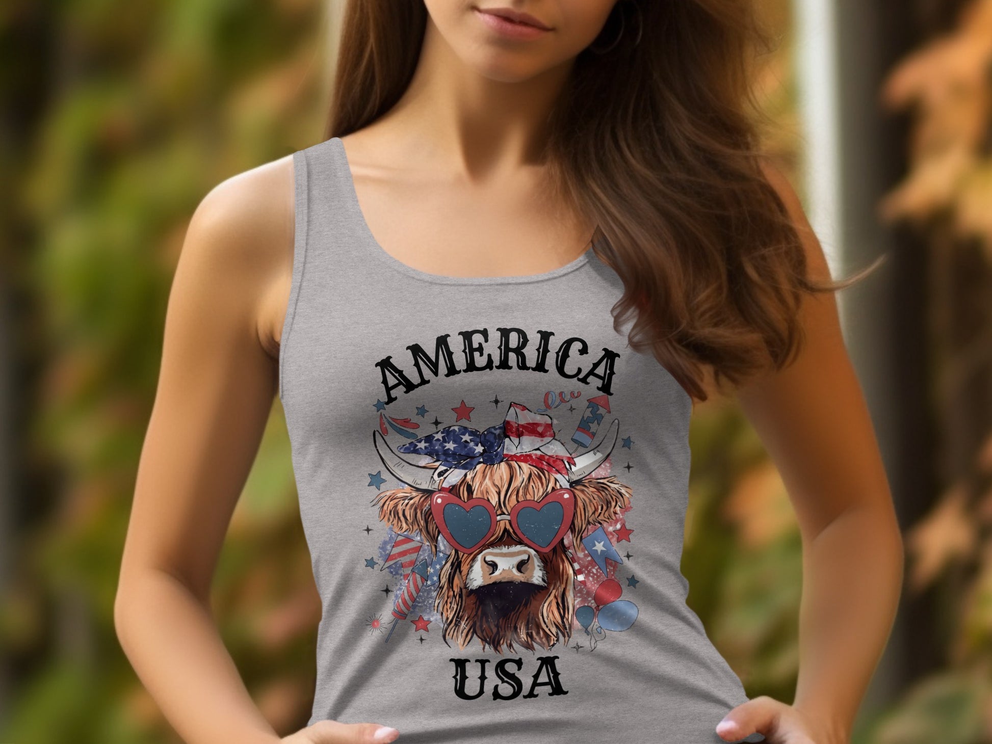 Highland cow with American flag bandana and heart sunglasses, text "AMERICA USA".