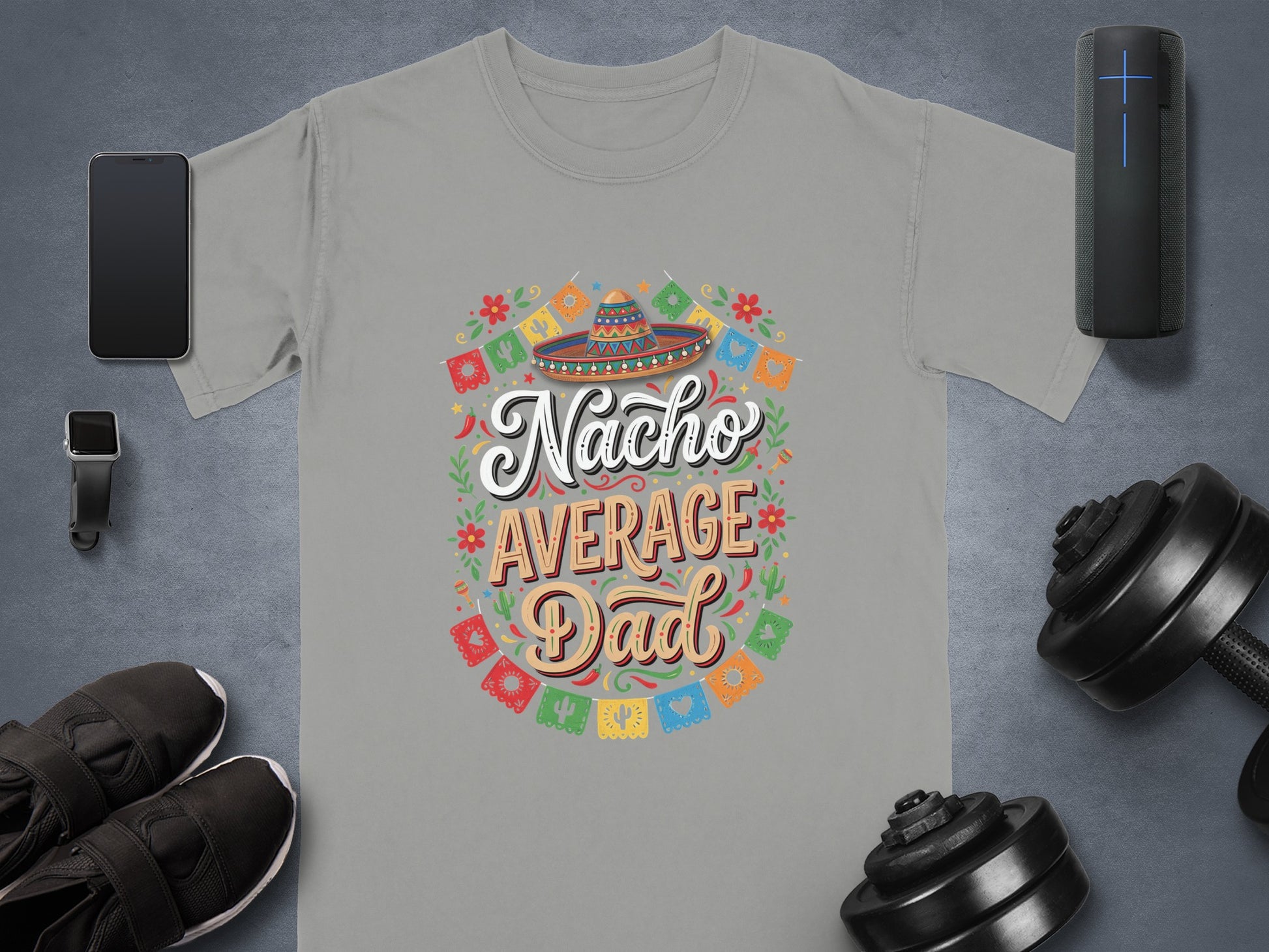 Nacho Average Dad t-shirt with colorful festive decorations and dumbbells.
