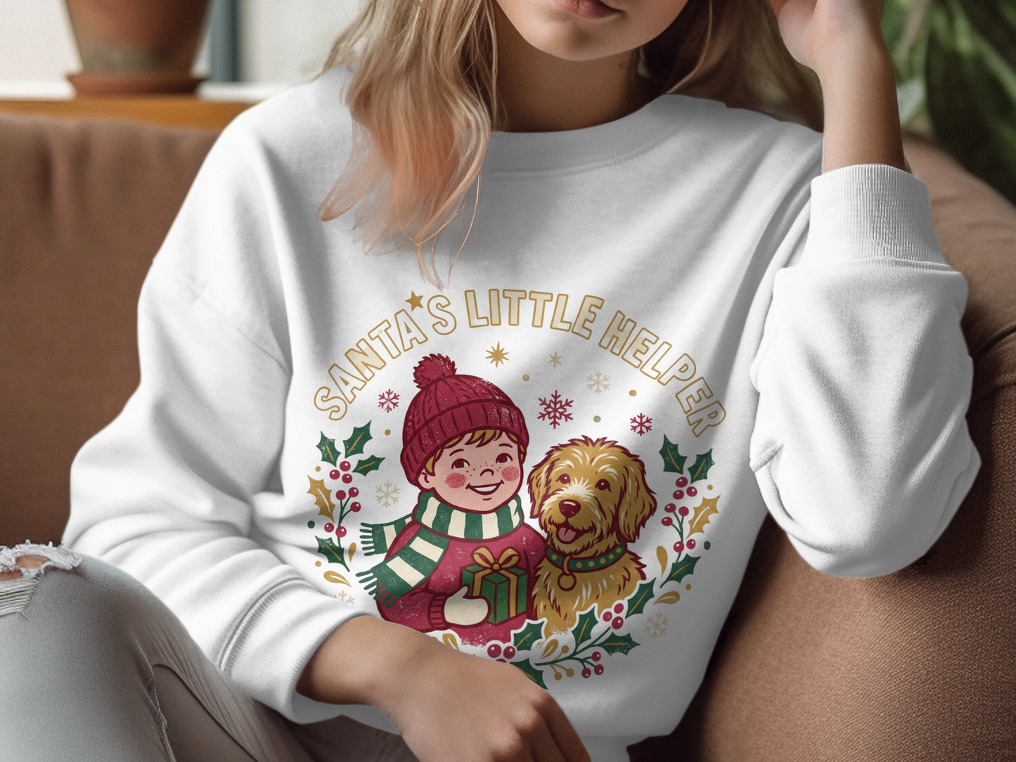 White sweatshirt with "Santa's Little Helper" text, a boy holding a gift, and a dog.