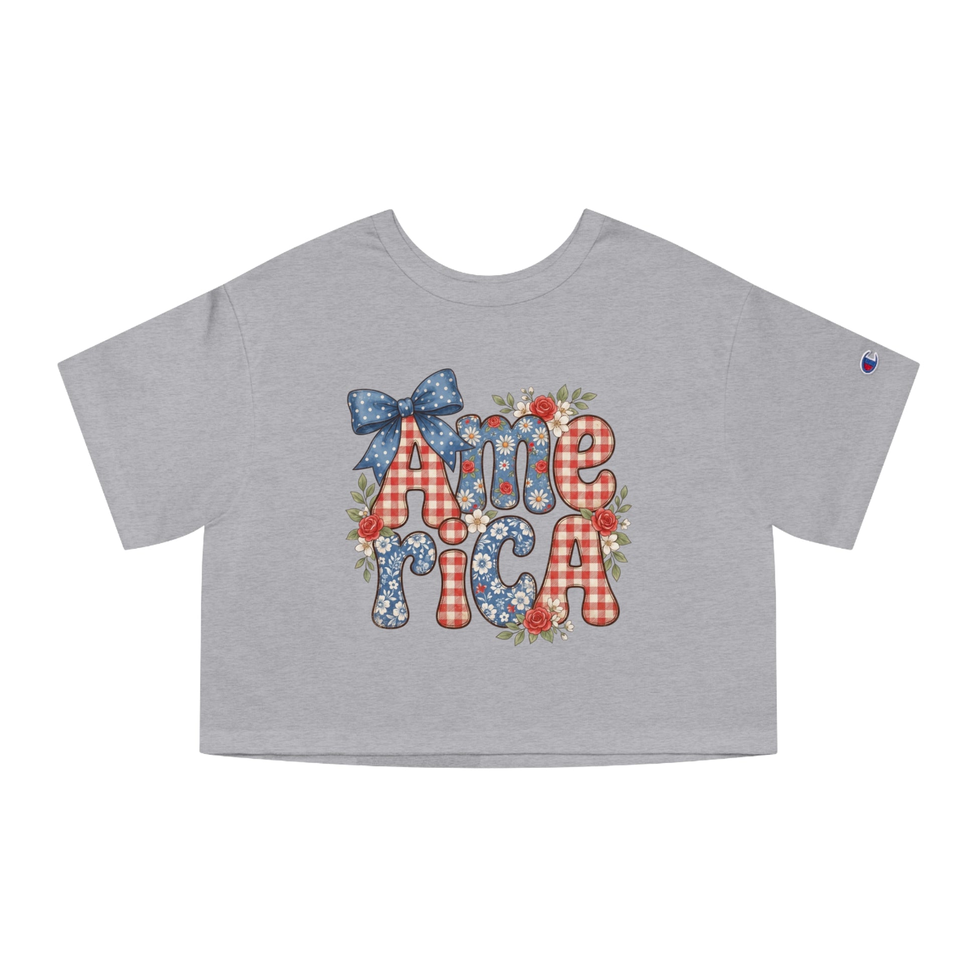 Grey cropped t-shirt with "America" text in floral and gingham patterns, framed by flowers.