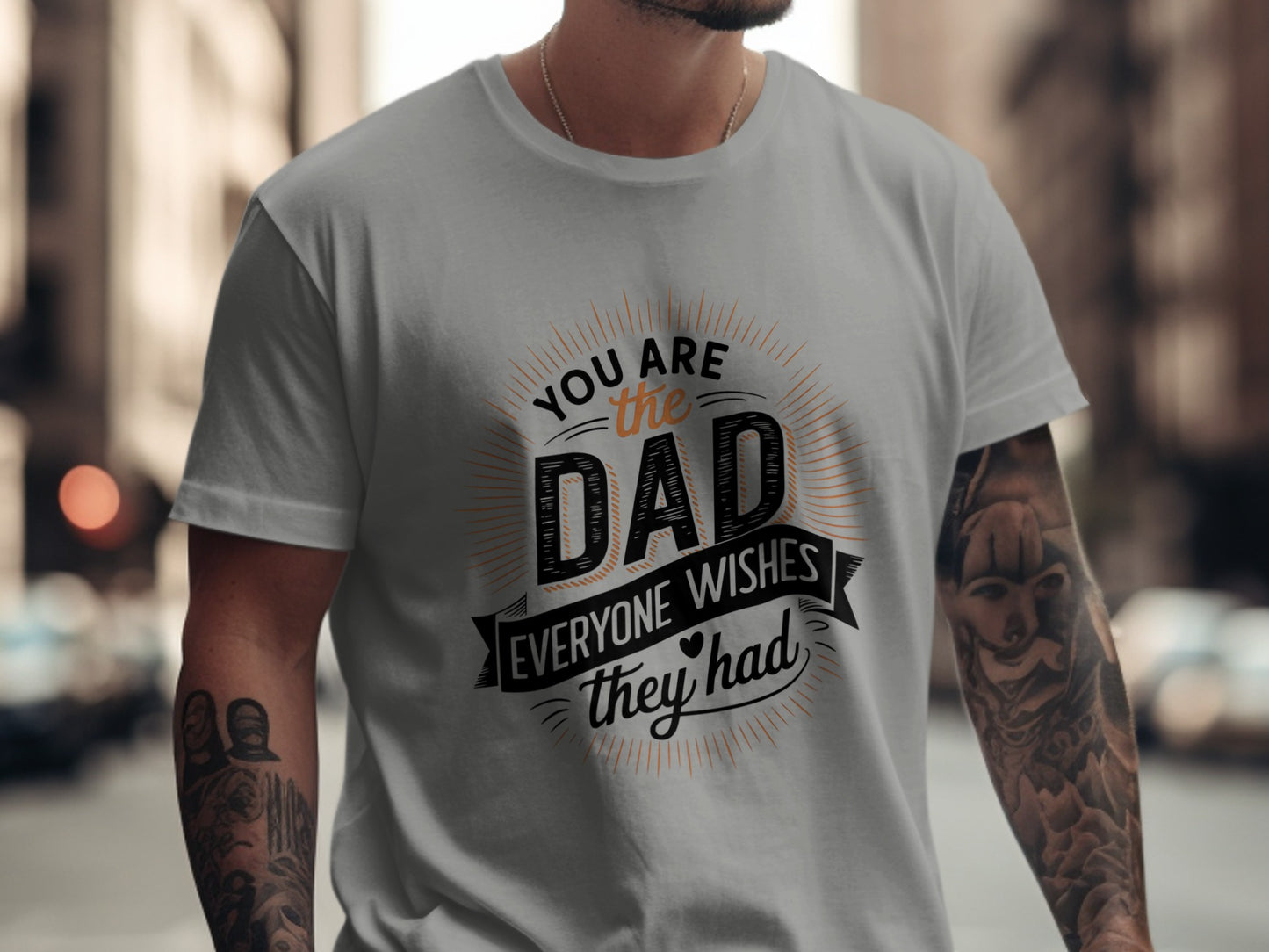 Orange text on a gray t-shirt reads "YOU ARE THE DAD EVERYONE WISHES THEY HAD".