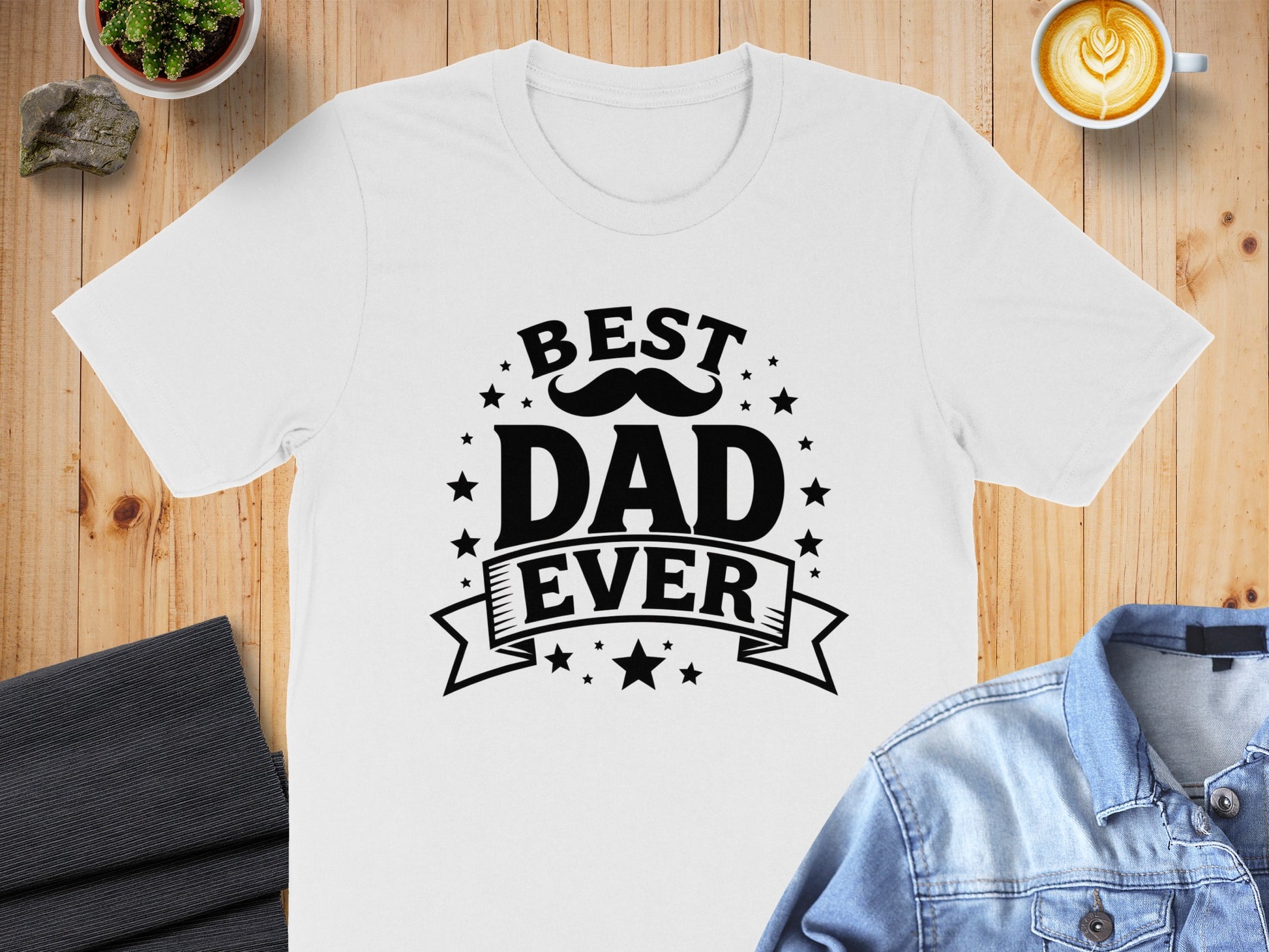 White t-shirt with "BEST DAD EVER" in black text, stars, and a mustache graphic.