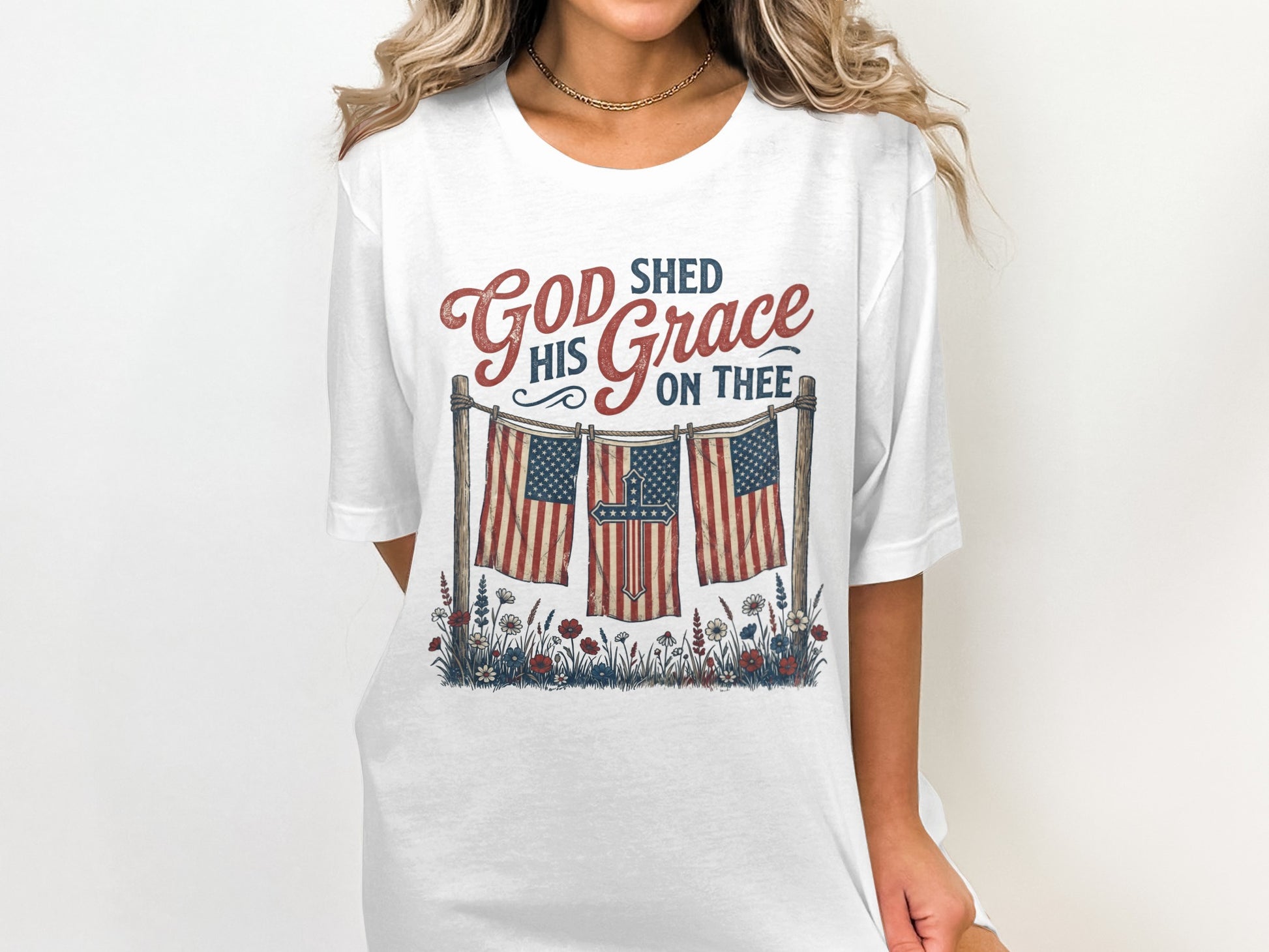 White t-shirt with "God Shed His Grace On Thee" and American flags.