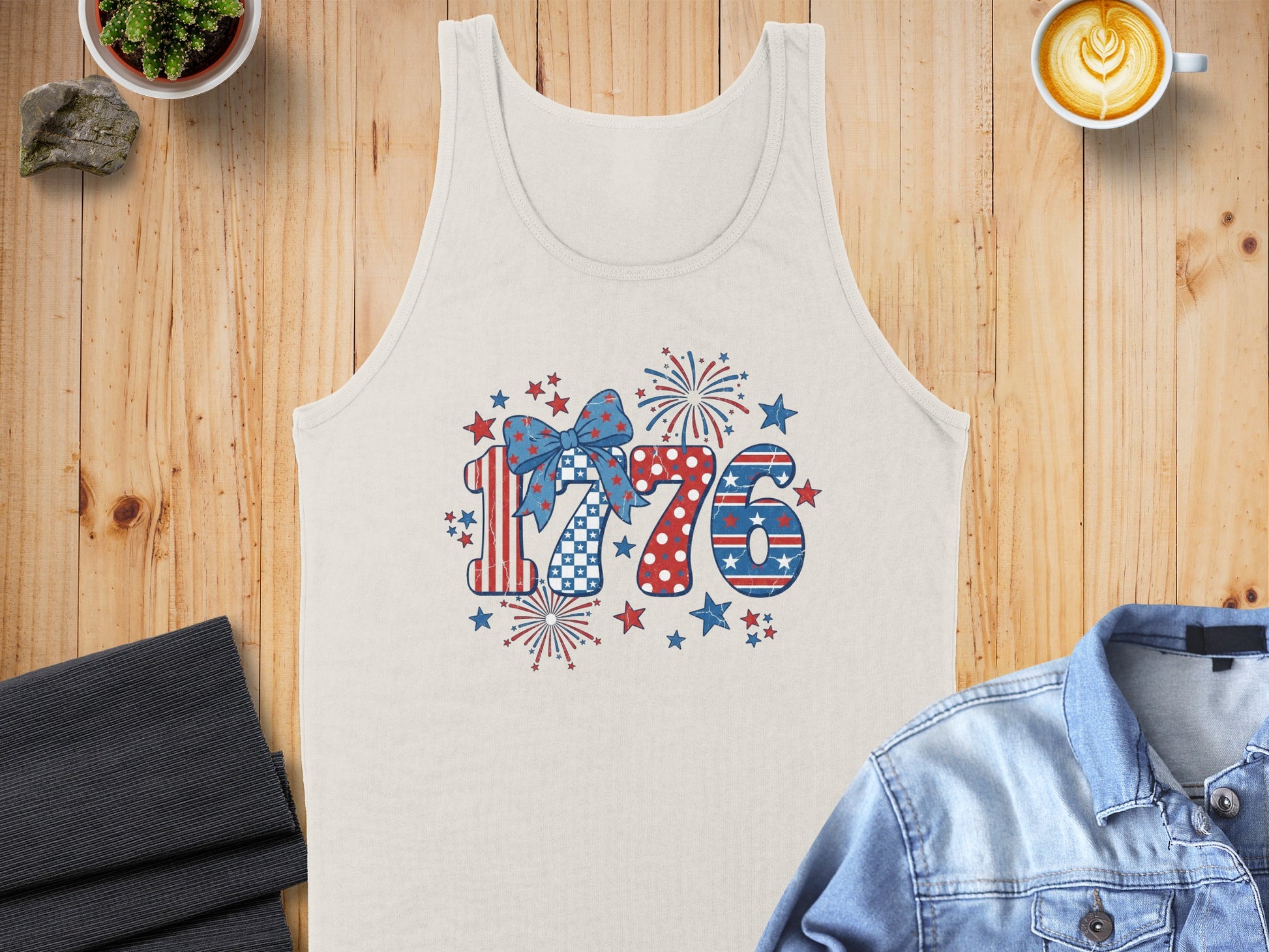 Tank top with patriotic 1776 graphic and distressed red, white, and blue elements.