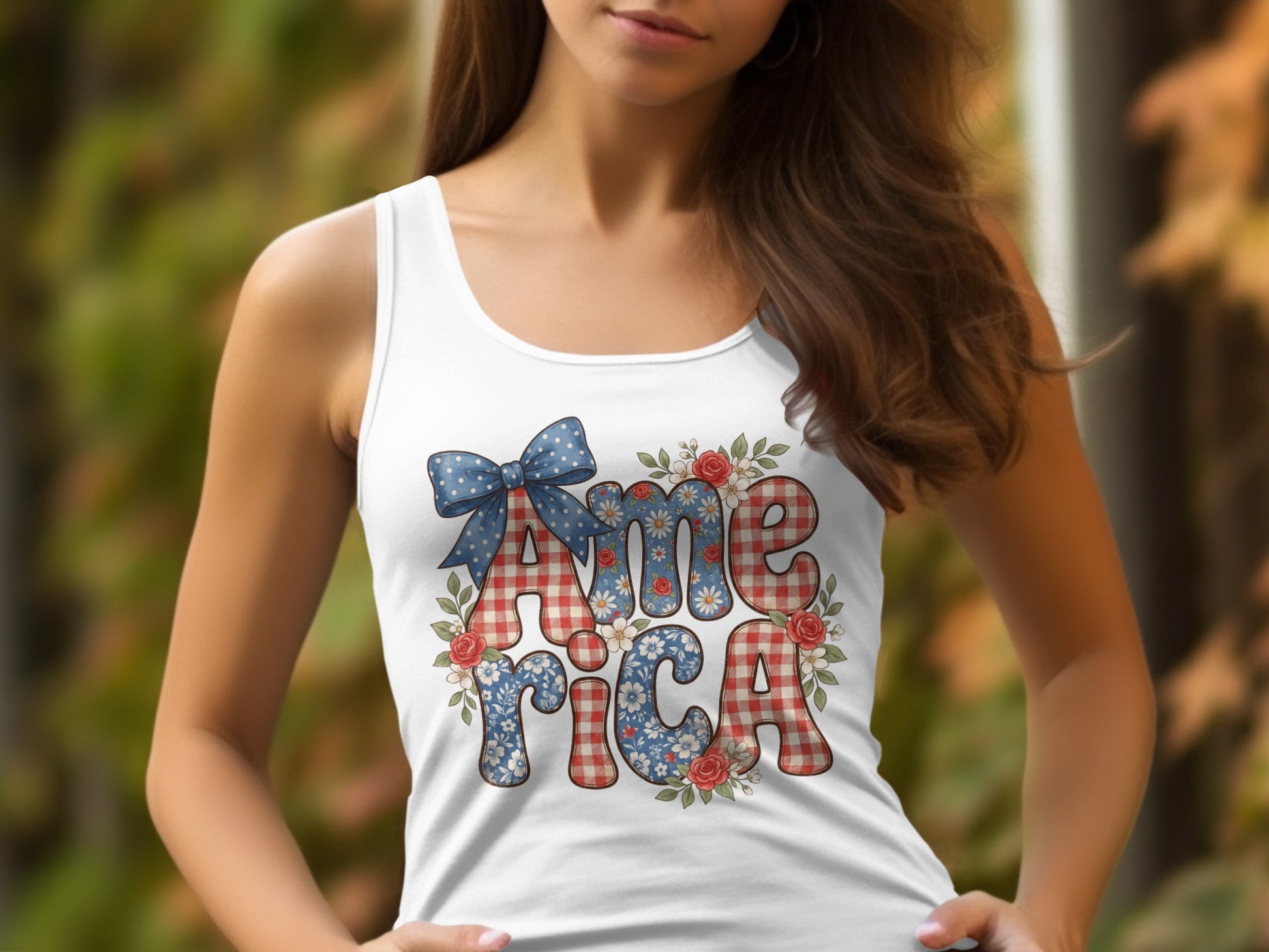 White tank top with "America" spelled out in patriotic patterns and floral accents.