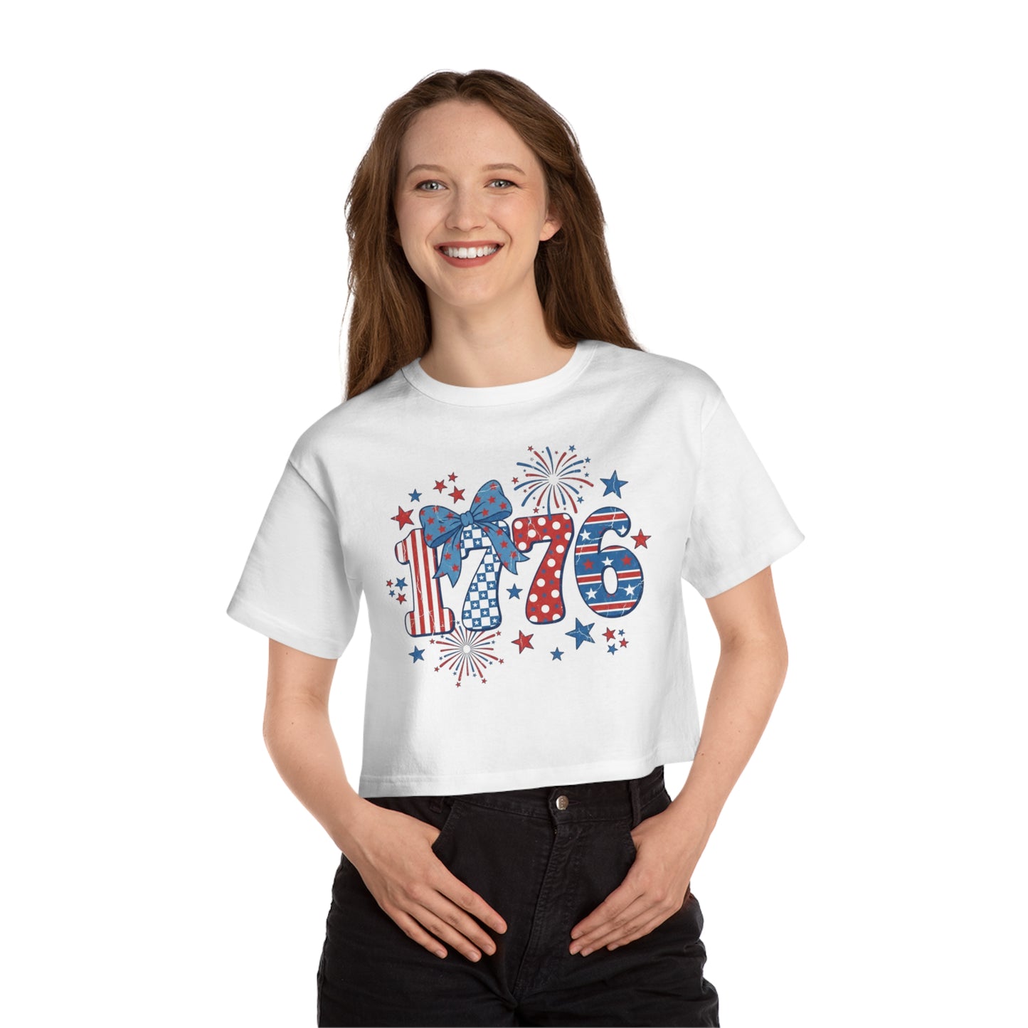 White cropped t-shirt with "1776" graphic featuring stars and fireworks.