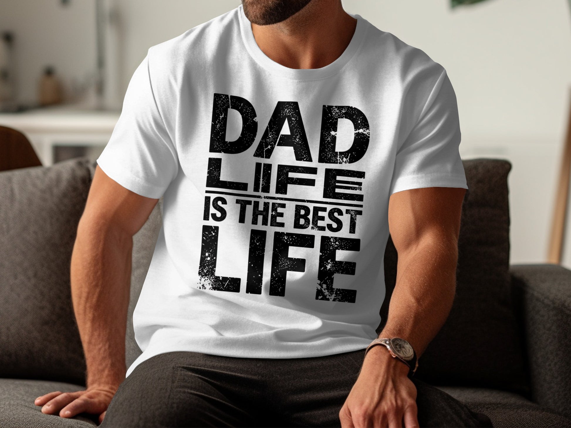 White t-shirt with black text "DAD IS THE BEST LIFE" worn by a man.