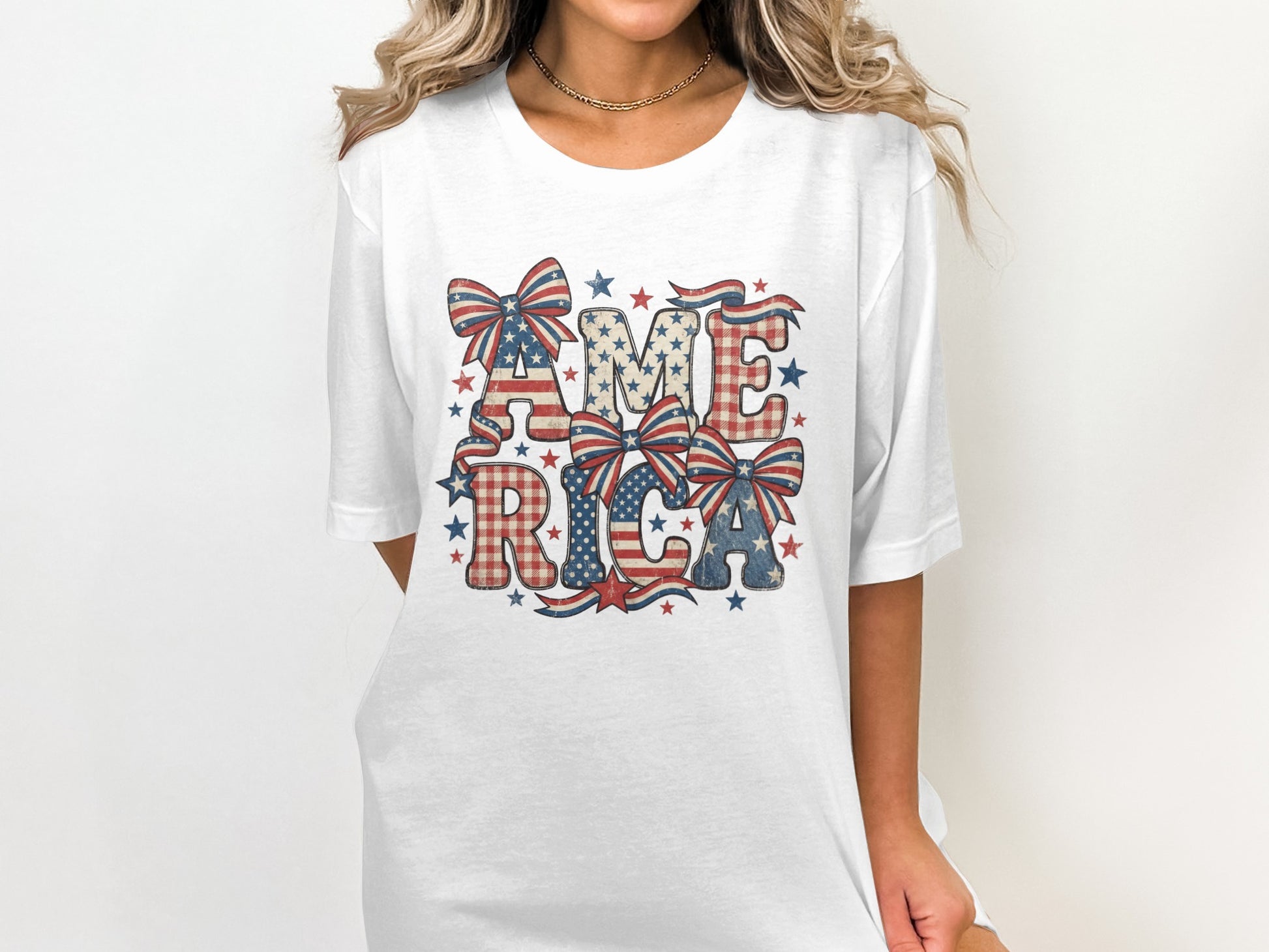 White t-shirt with red, white, and blue "AMERICA" text and bows.