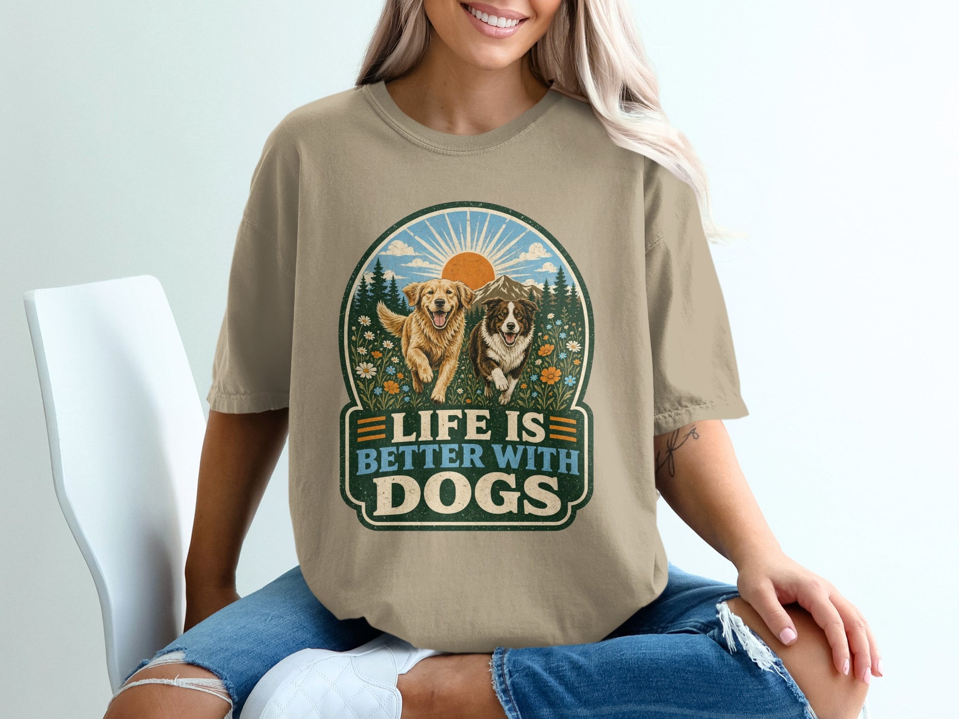 T-shirt graphic with two happy dogs in a field of flowers, text reads "Life is Better With Dogs".