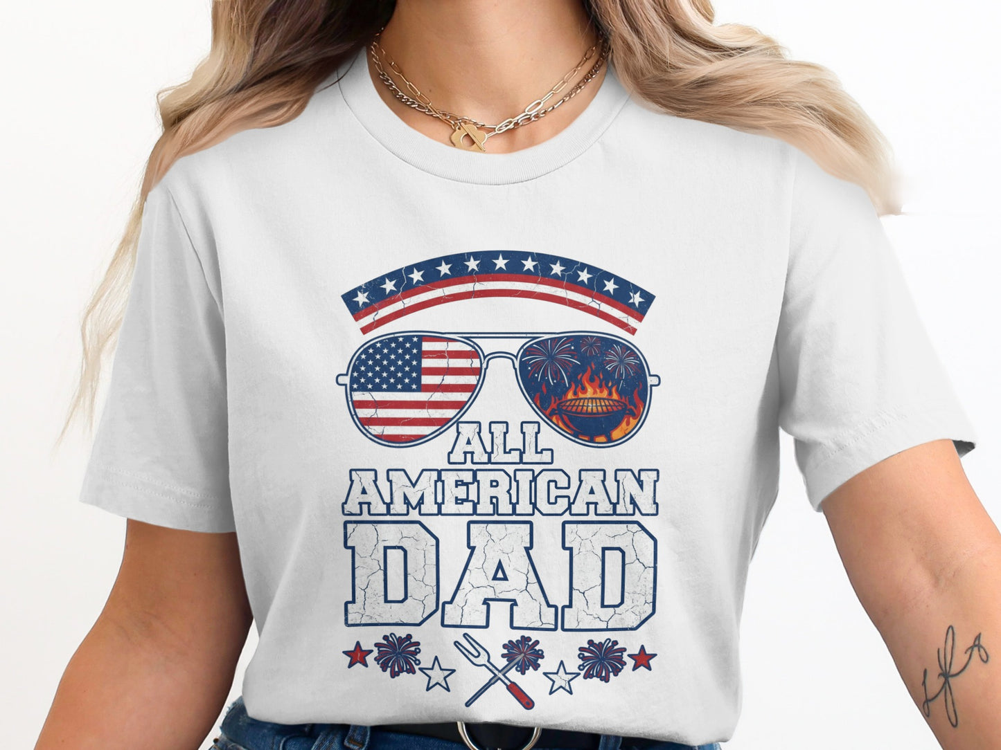 White t-shirt with "All American Dad" text and sunglasses with American flag.