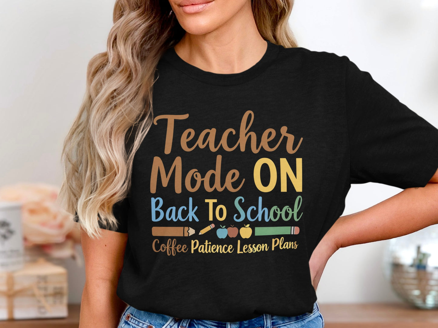 Black t-shirt graphic with text "Teacher Mode ON Back To School Coffee Patience Lesson Plans."