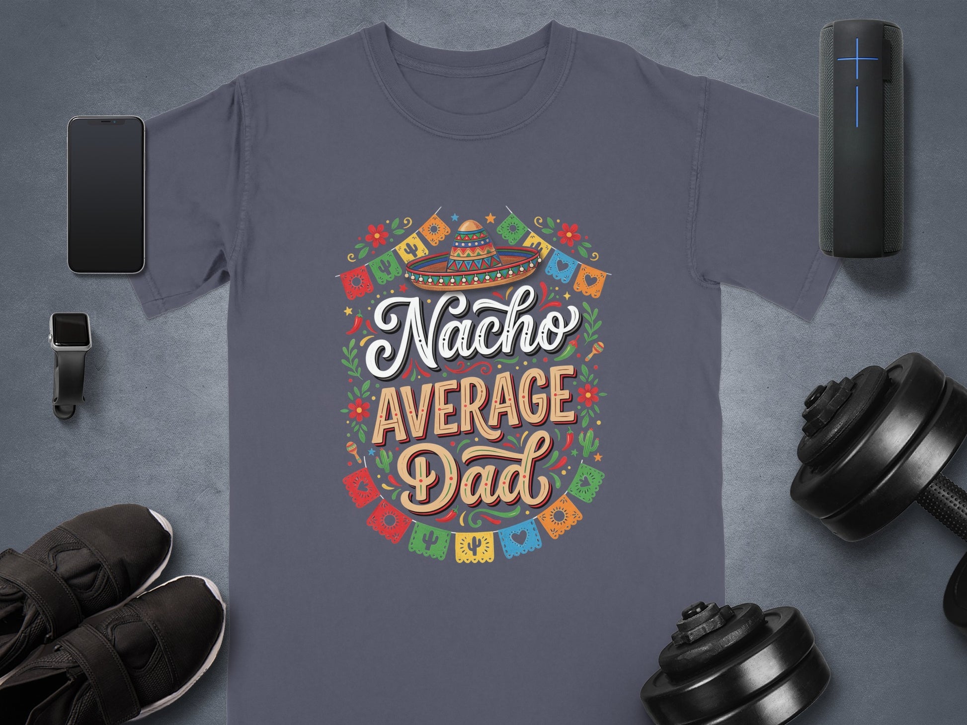 Nacho Average Dad t-shirt with festive border and dumbbells, watch, and speaker.