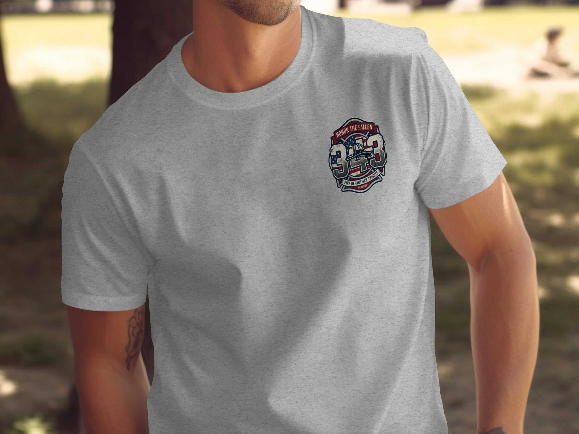 Gray t-shirt with a 343 fire department tribute badge on the left chest.
