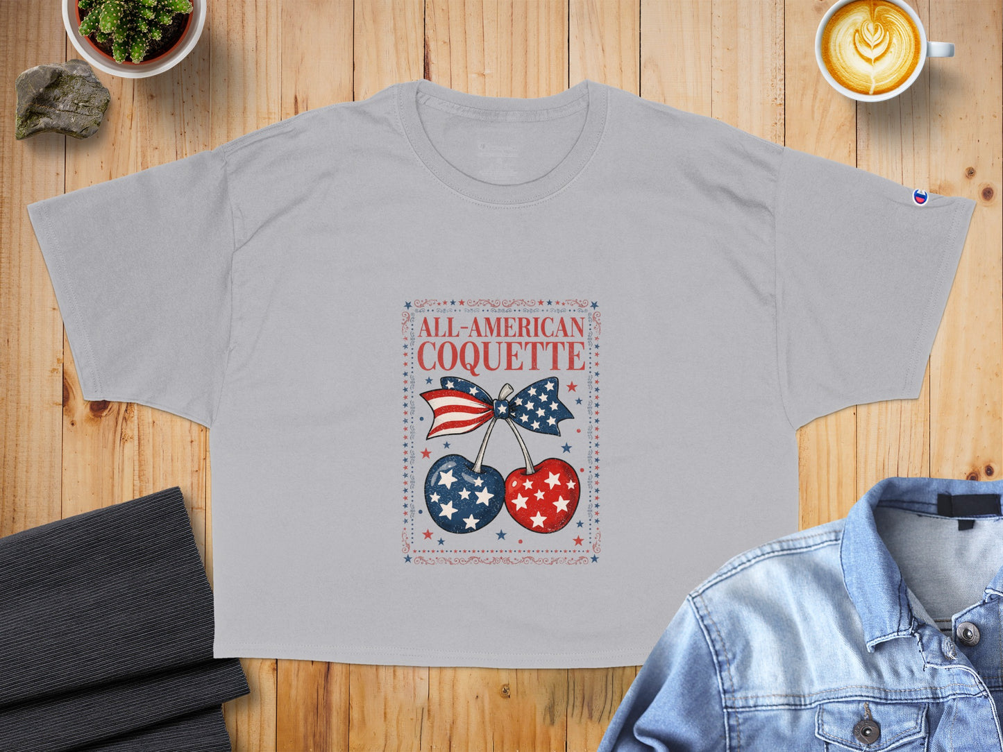 Grey t-shirt with "ALL-AMERICAN COQUETTE" and patriotic cherries graphic.
