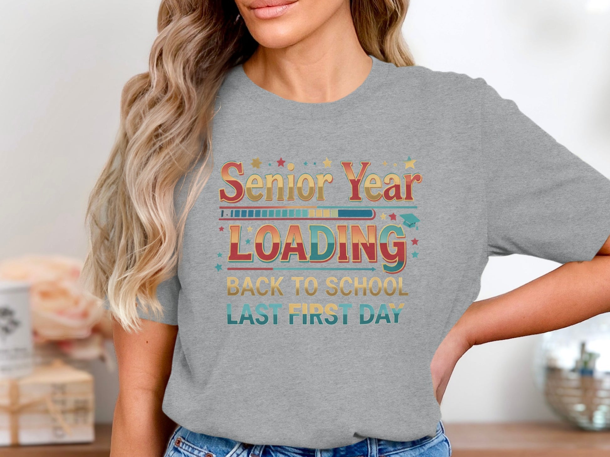 Grey t-shirt with "Senior Year LOADING Back to School Last First Day" design.