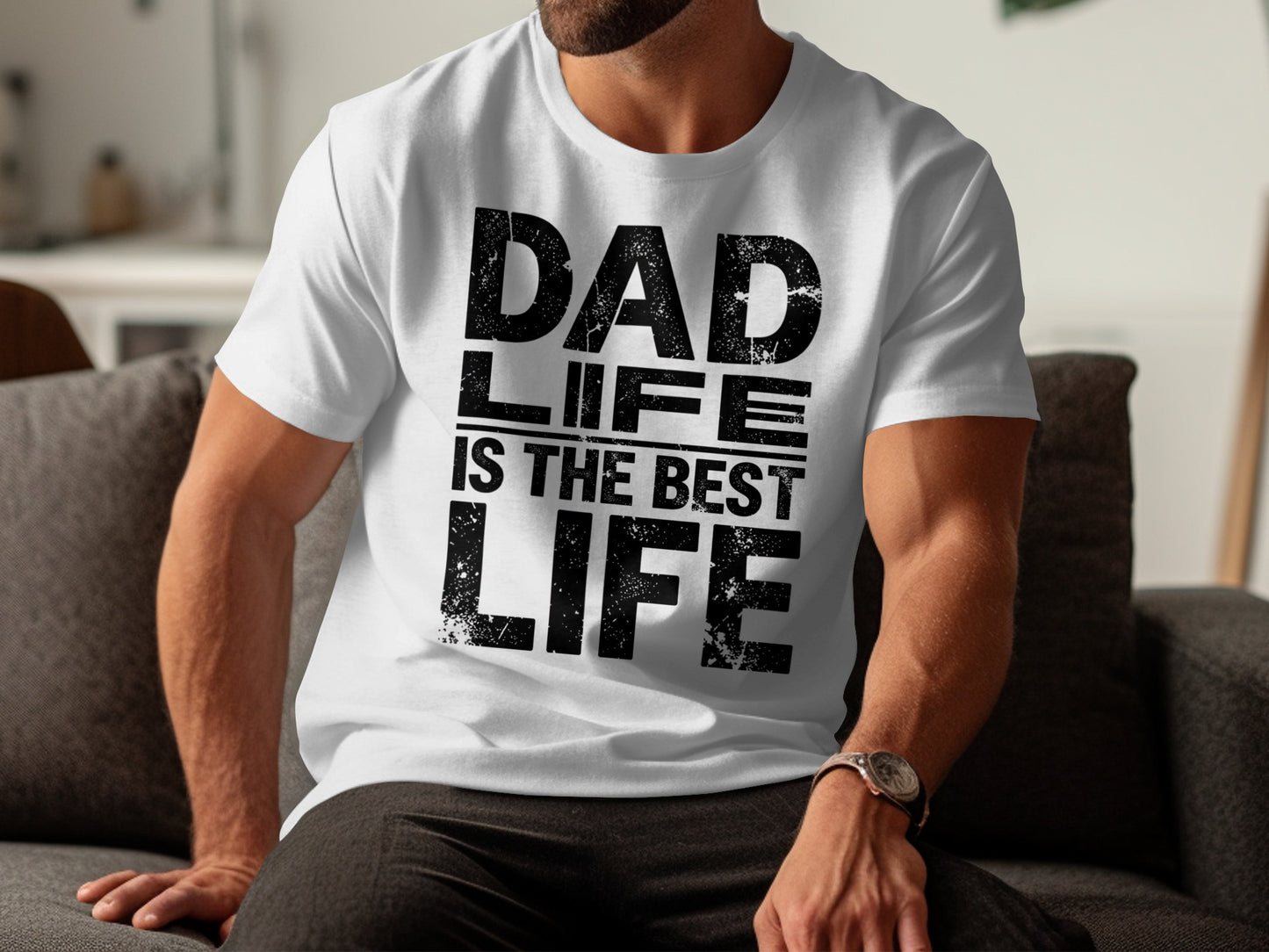 White t-shirt with "DAD IS THE BEST LIFE" text, worn by a person.