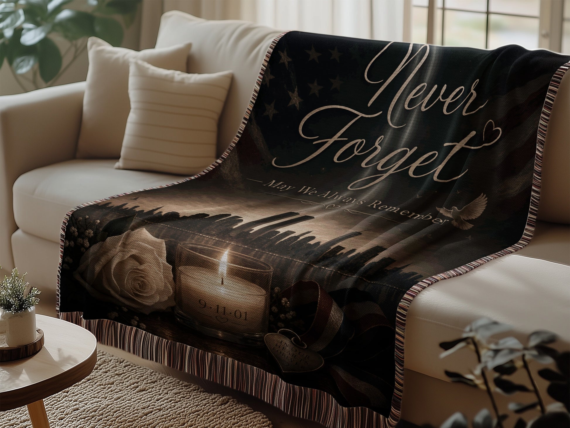 Tapestry depicting "Never Forget," a candle, a rose, and skyline on a couch.