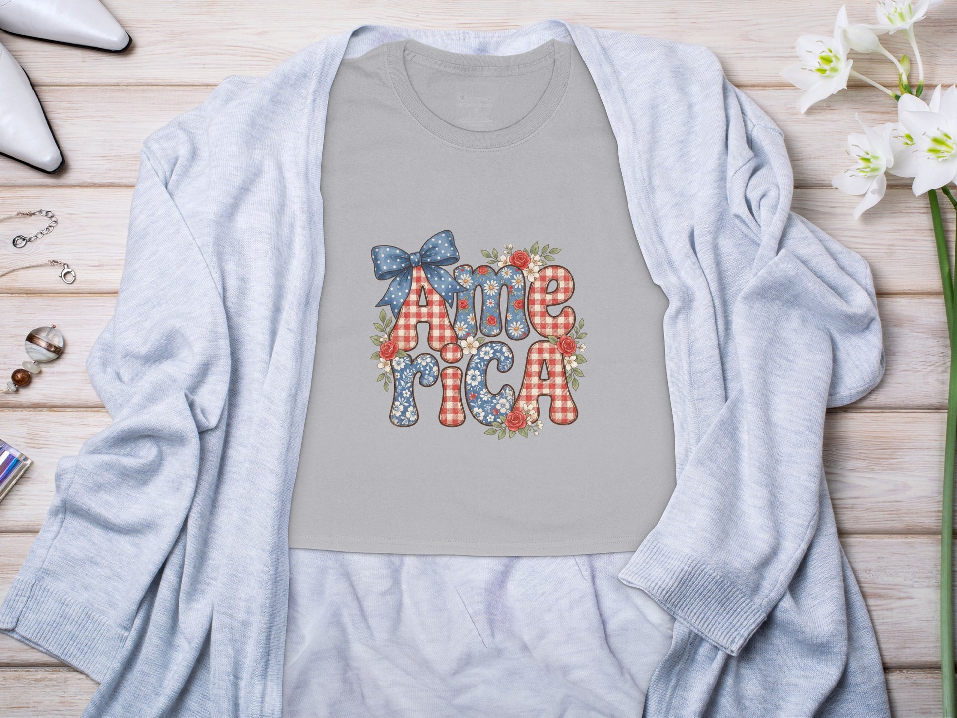 Grey t-shirt with "America" text in festive patriotic red, white, and blue patterns.