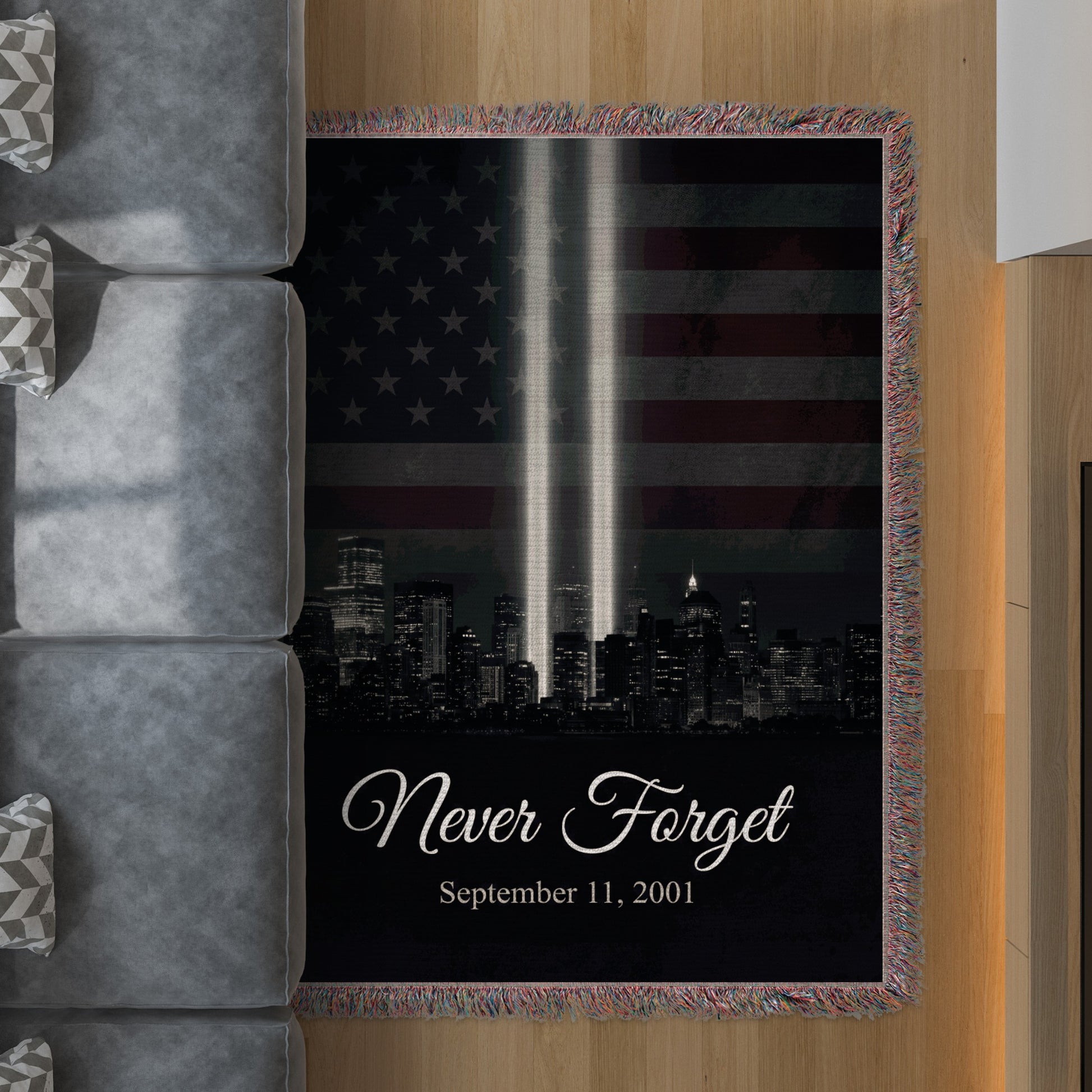 Tribute blanket with US flag, twin towers lights, and "Never Forget September 11, 2001".