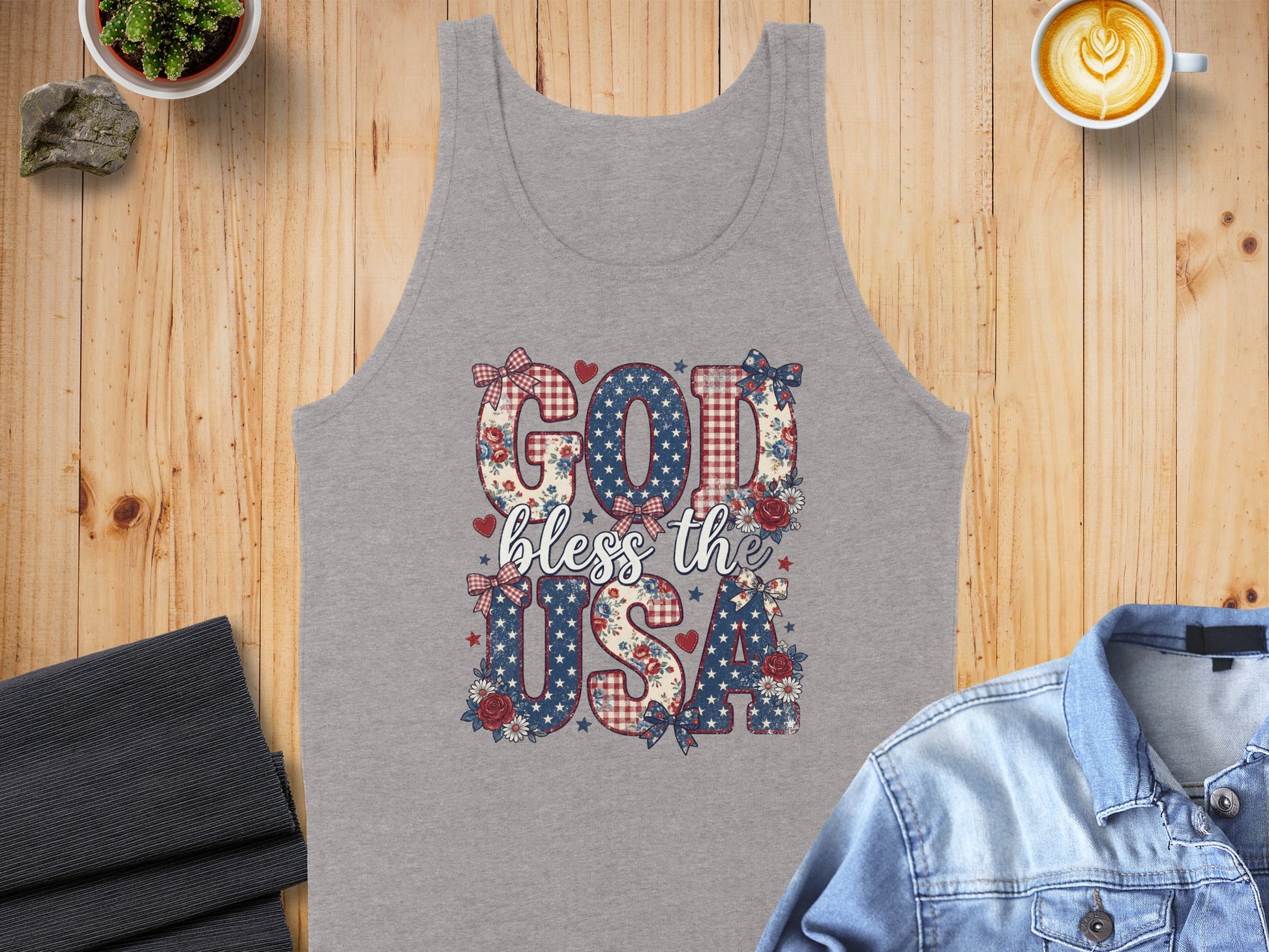 Gray tank top with "God bless the USA" in patriotic patterned letters.