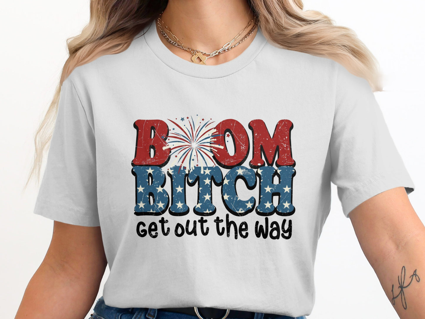 White t-shirt with "BOOM BITCH GET OUT THE WAY" in patriotic text and fireworks.