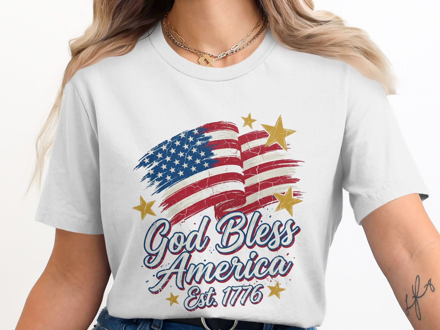 White t-shirt with distressed US flag and "God Bless America Est. 1776".