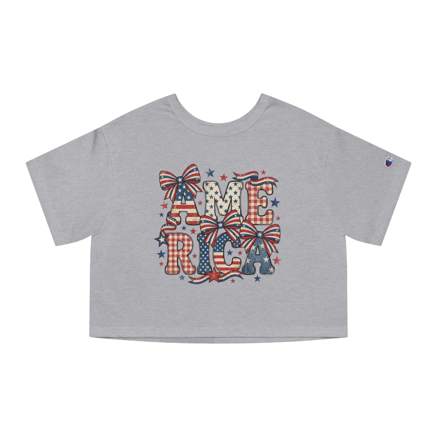Grey crop t-shirt with "AMERICA" graphic featuring red, white, and blue patriotic patterns and bows.
