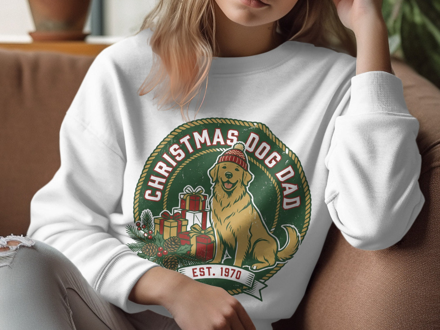 White sweatshirt with a circular Christmas Dog Dad graphic featuring a golden retriever and gifts.