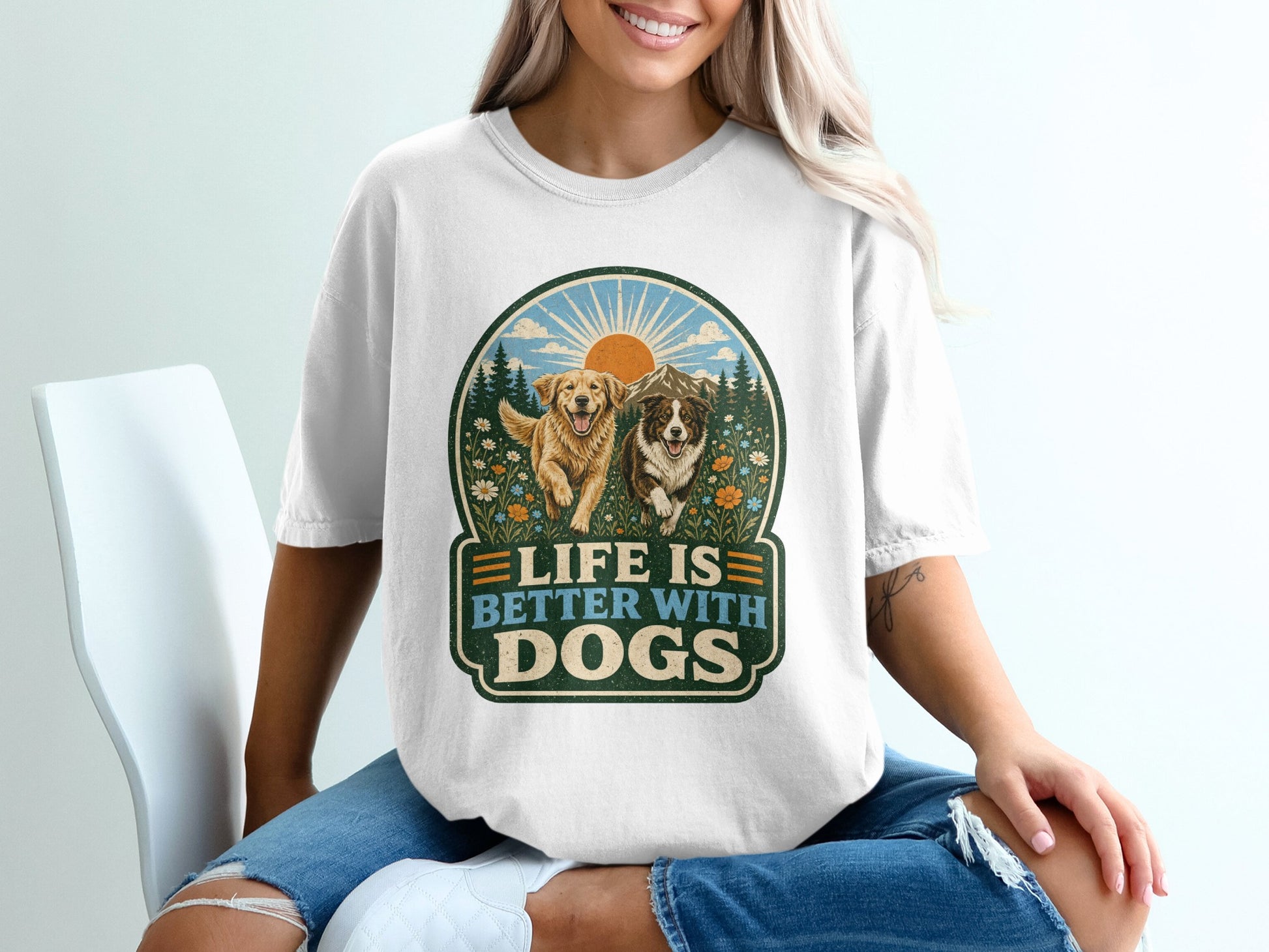 T-shirt graphic with two dogs in a landscape, text reads "Life is Better With Dogs".