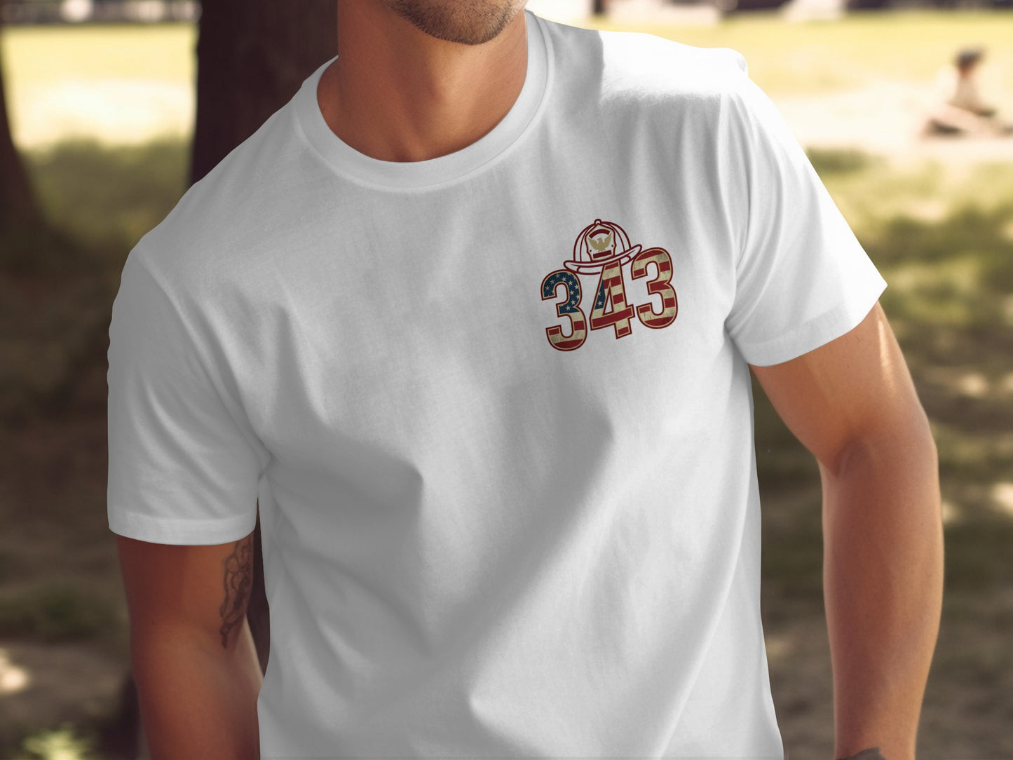 White t-shirt with a "343" graphic featuring an American flag and firefighter helmet.