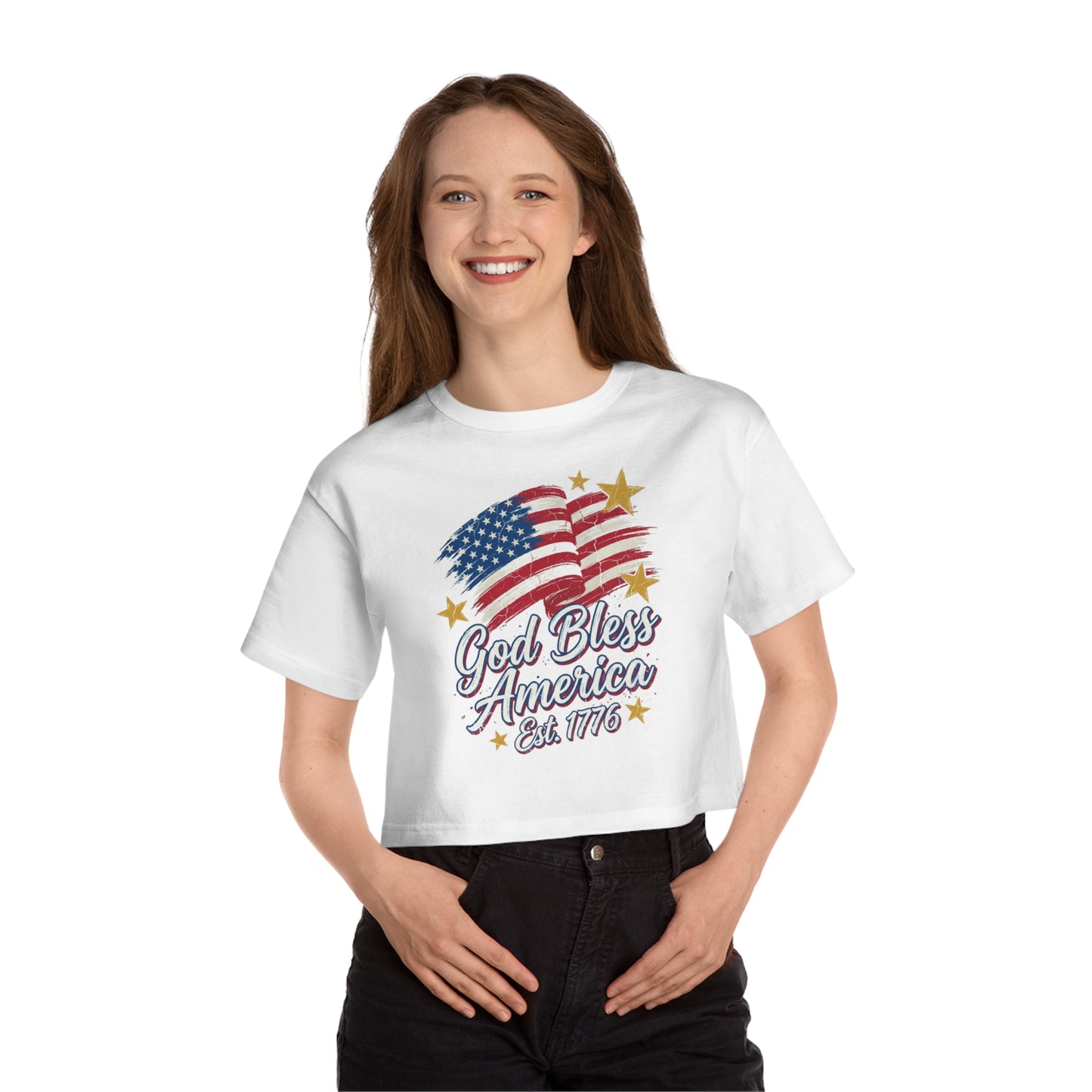White crop top with distressed US flag graphic and text "God Bless America Est. 1776".