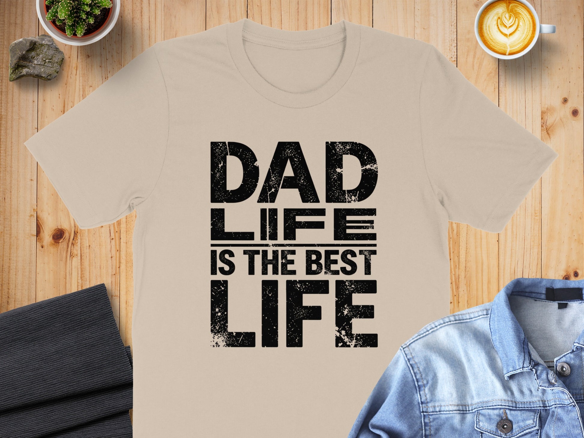 Beige t-shirt with black text "DAD LIFE IS THE BEST LIFE".